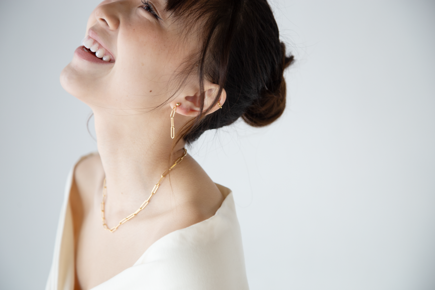 Artistic profile portraits showing elegant hairstyle and jewelry details.