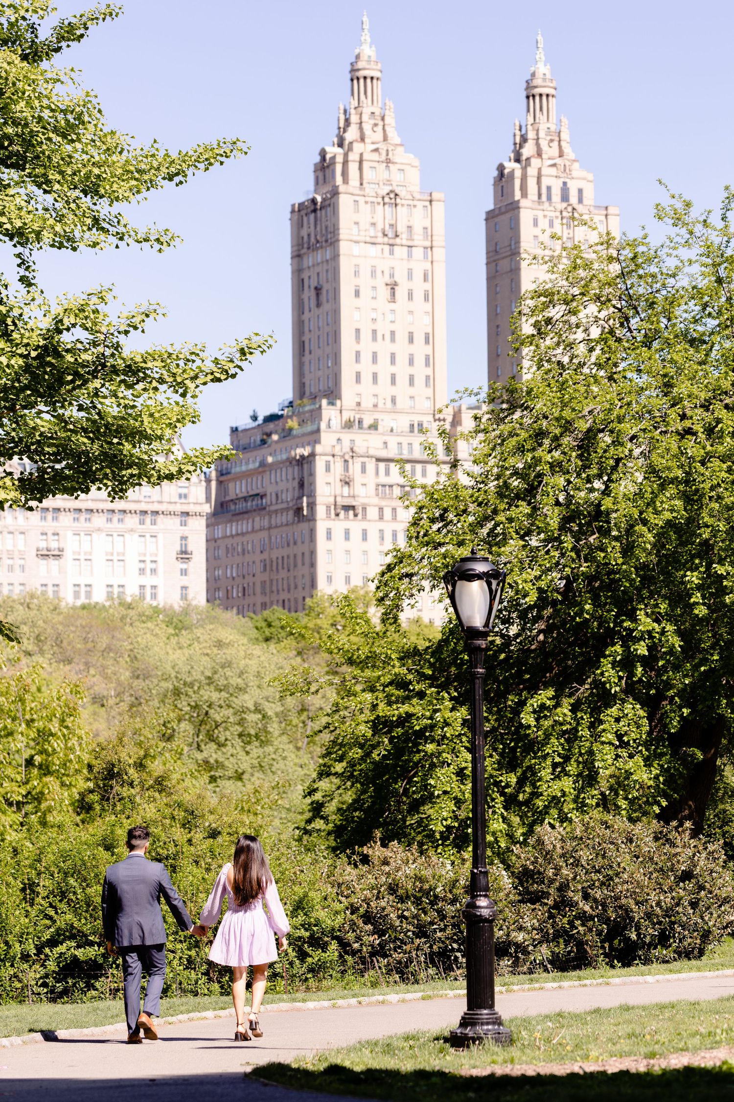 couple walking in central park summer