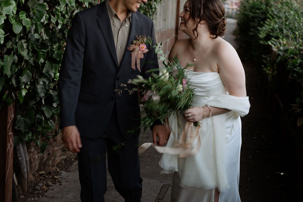 A series of romantic wedding photos showing intimate moments between a couple in a garden setting surrounded by greenery.