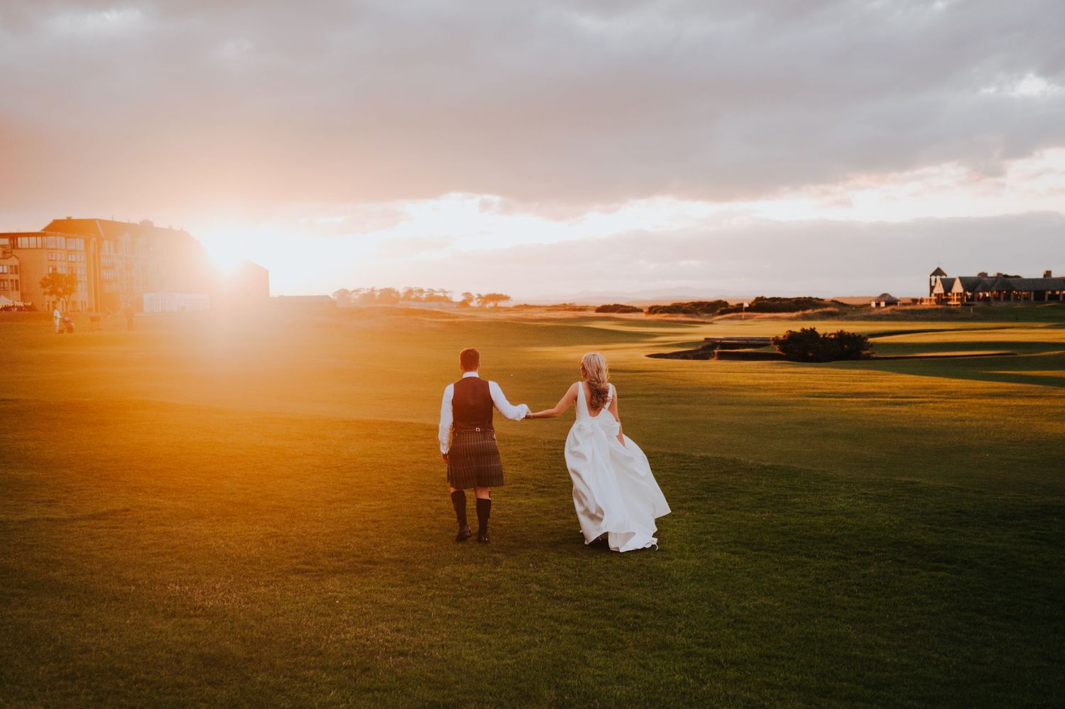golden hour bride and groom at st andrews old course
