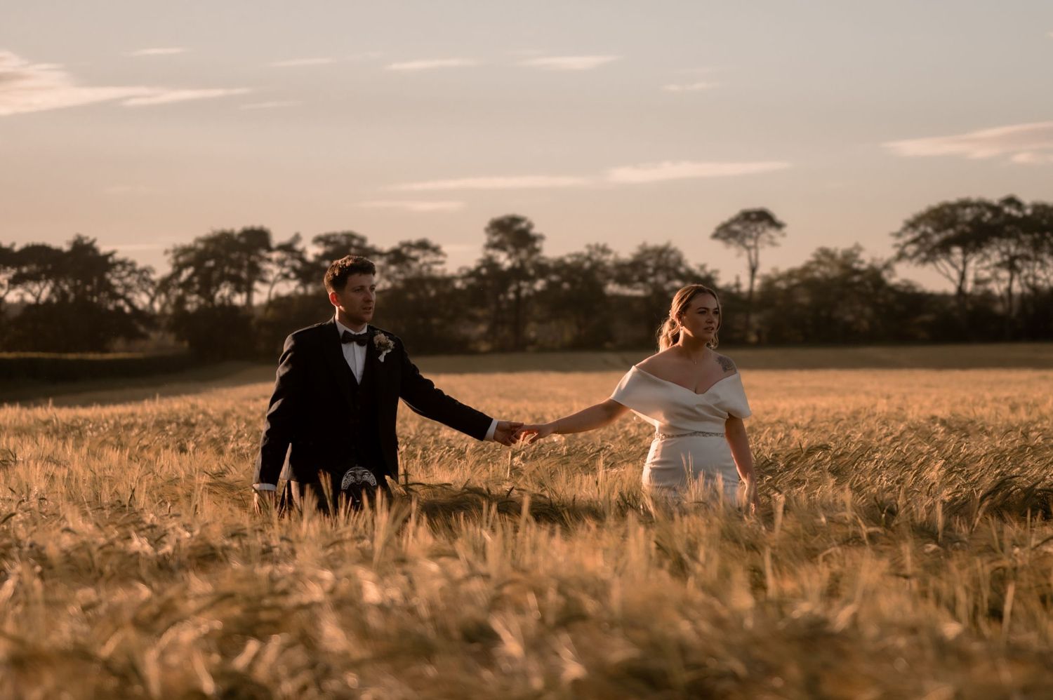 golden hour bride and groom by scottish editorial wedding photographer