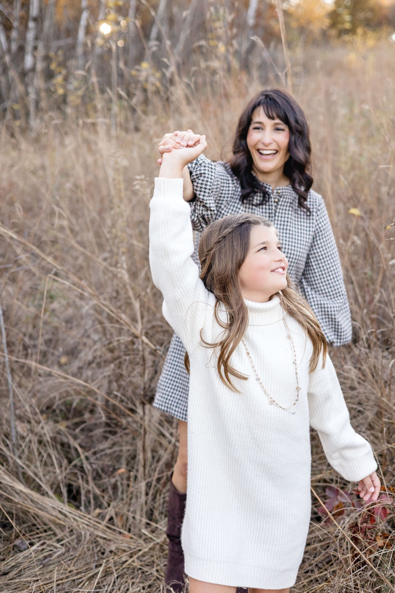 A candid series of outdoor photos showing joyful interactions between two people wearing cozy sweaters in autumn scenery.