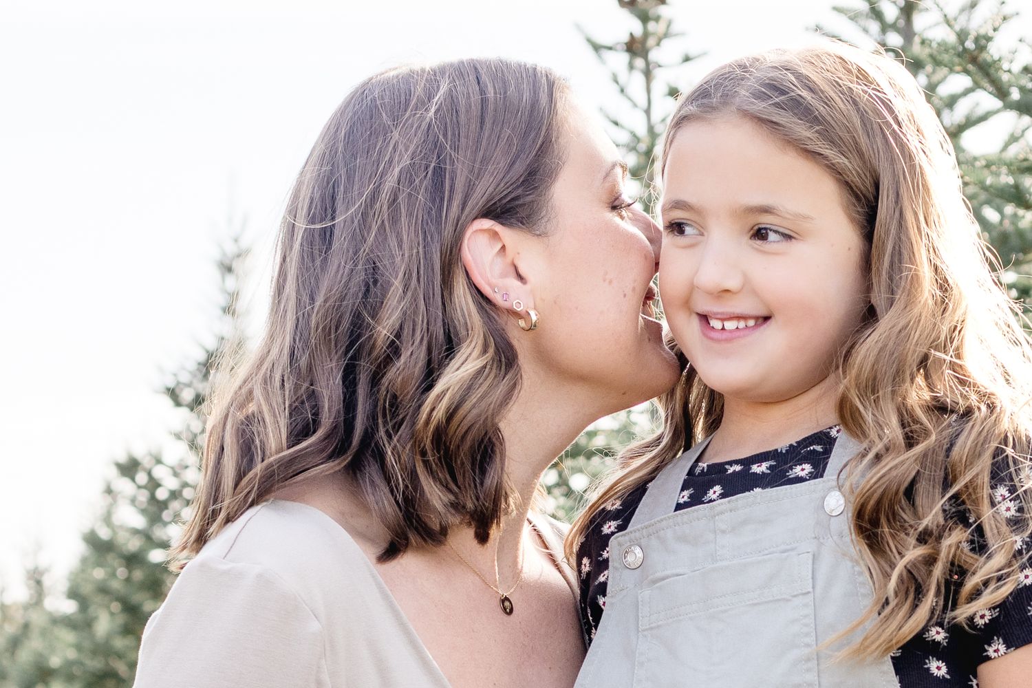 Intimate outdoor portrait session capturing genuine moments between children.