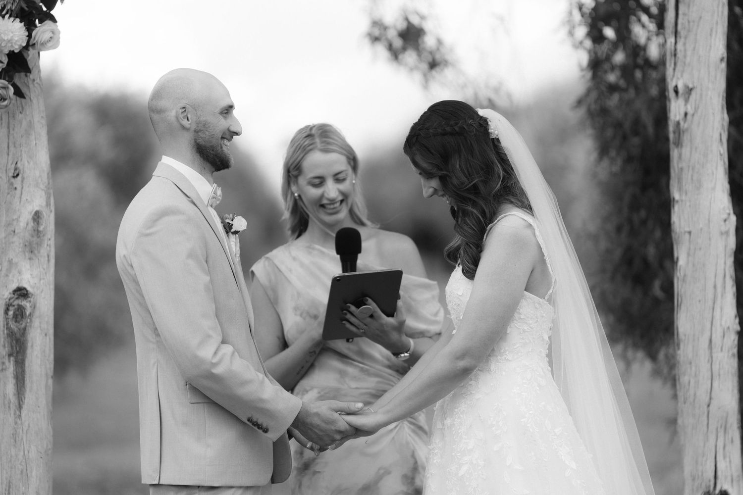 Black and white wedding photo collage showing intimate moments between a couple during their celebration.