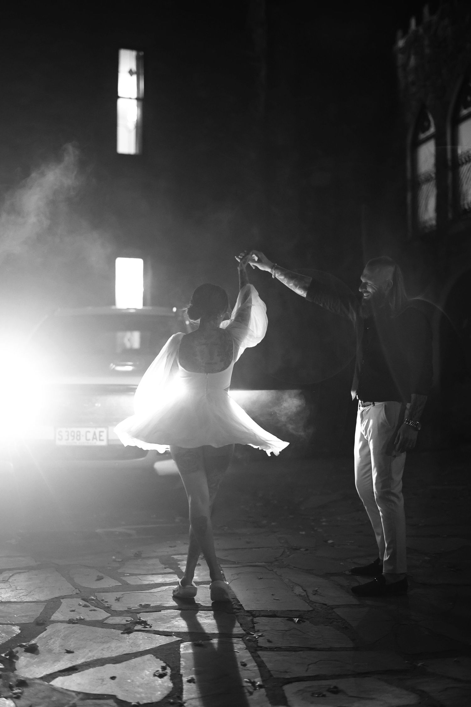Dramatic black and white photo sequence showing silhouettes of people in fog with bright backlighting creating moody atmosphere.