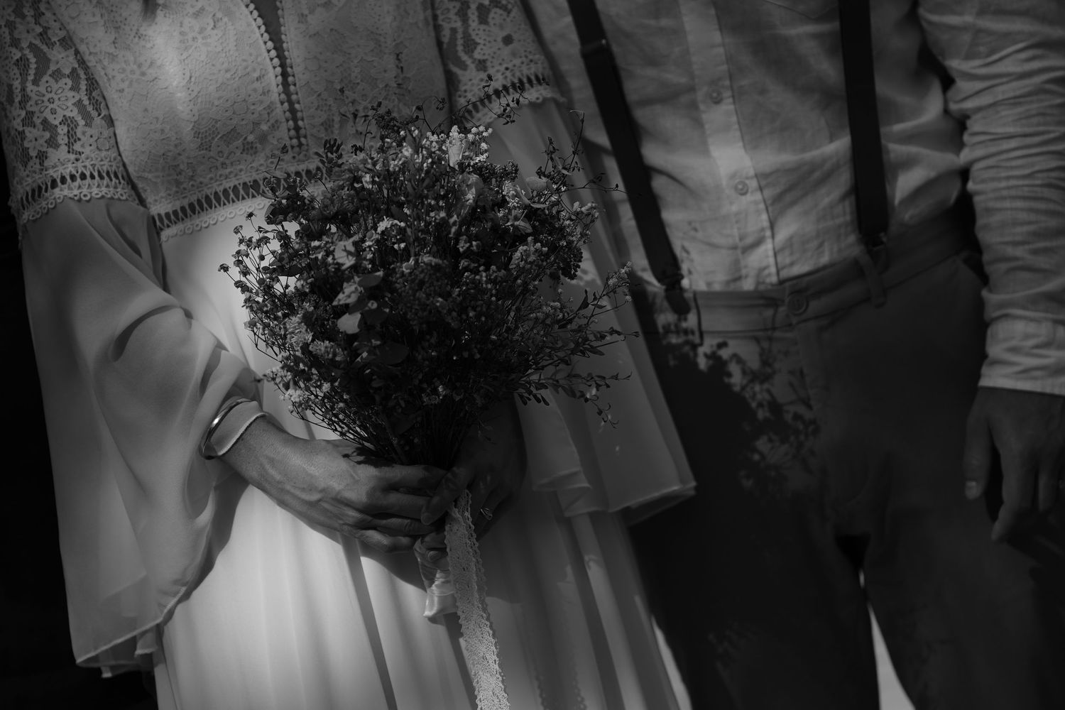A series of black and white wedding photos showing bouquets, dresses, and candid moments during a celebration.