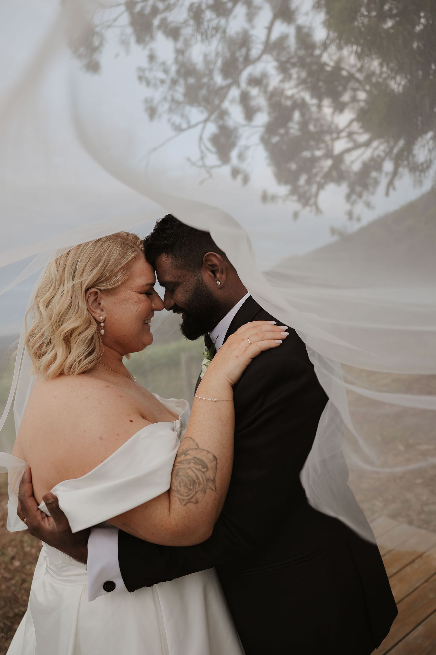A romantic wedding couple shares intimate moments together in a series of candid outdoor photographs.