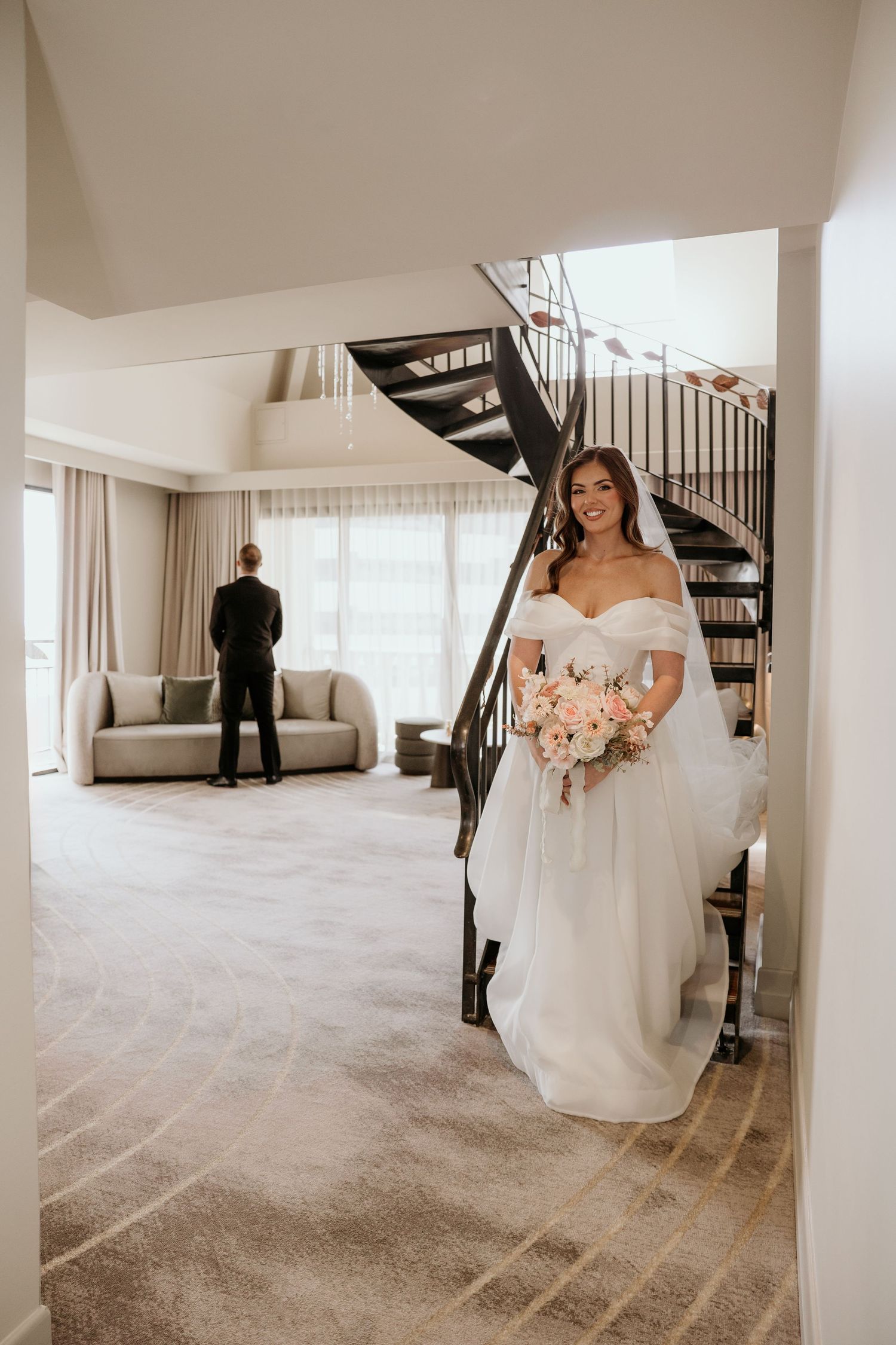 A series of wedding preparation photos showing a bride in a white dress getting ready in a modern, light-filled room.