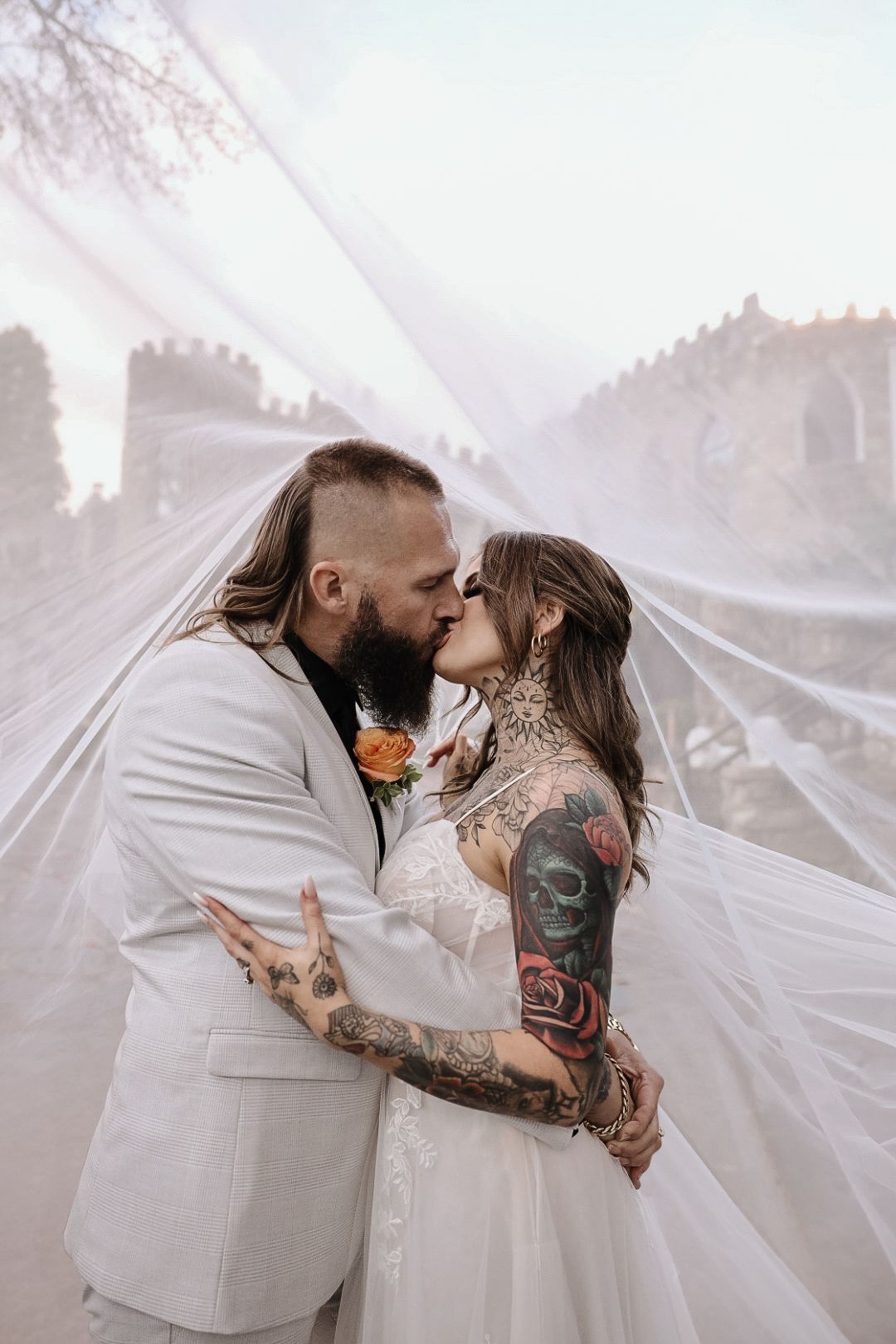 A romantic wedding couple shares intimate kisses under a flowing white veil in a series of artistic photos.