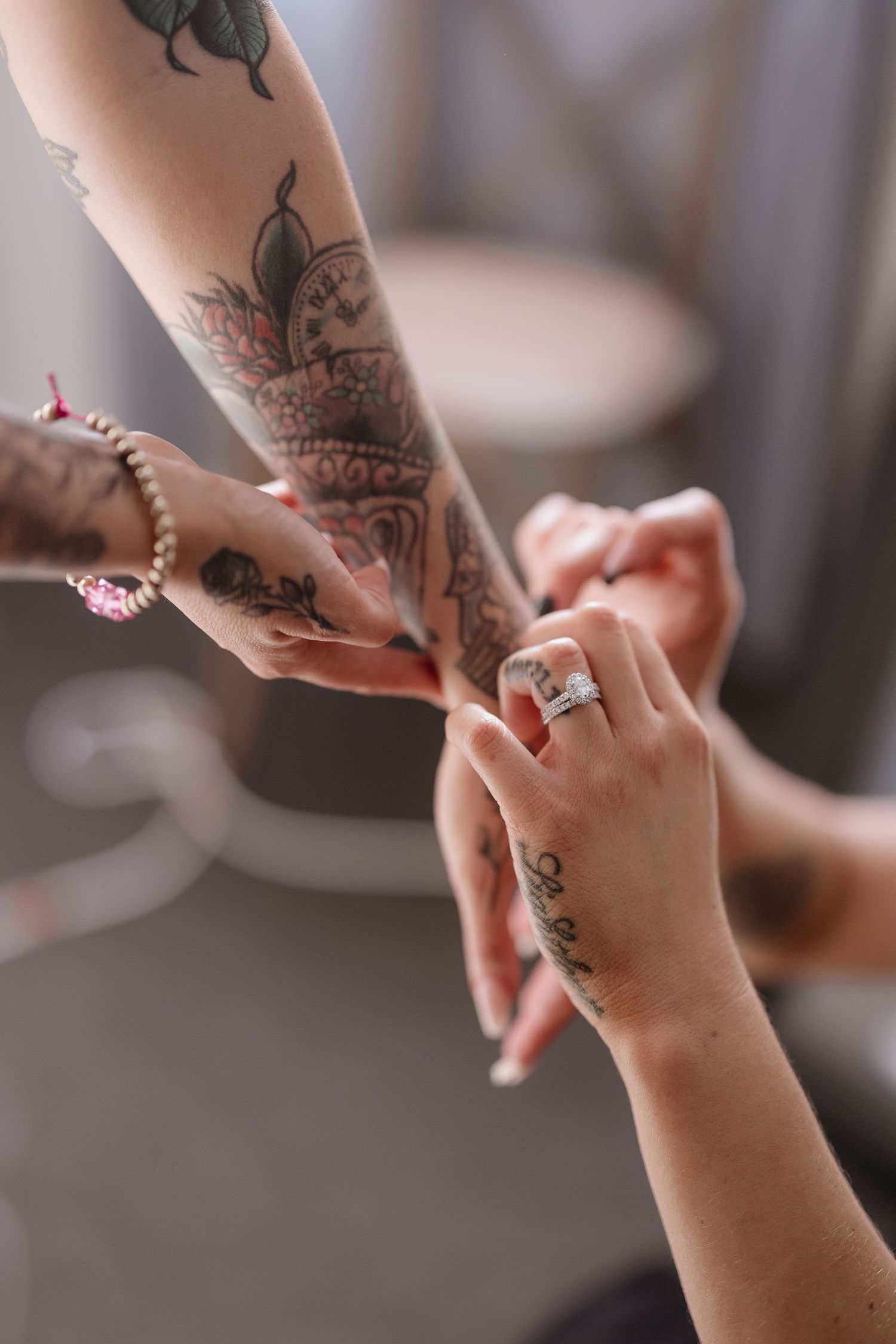 Close-up sequence of hands applying intricate henna designs on fingers and palms in traditional mehndi style.