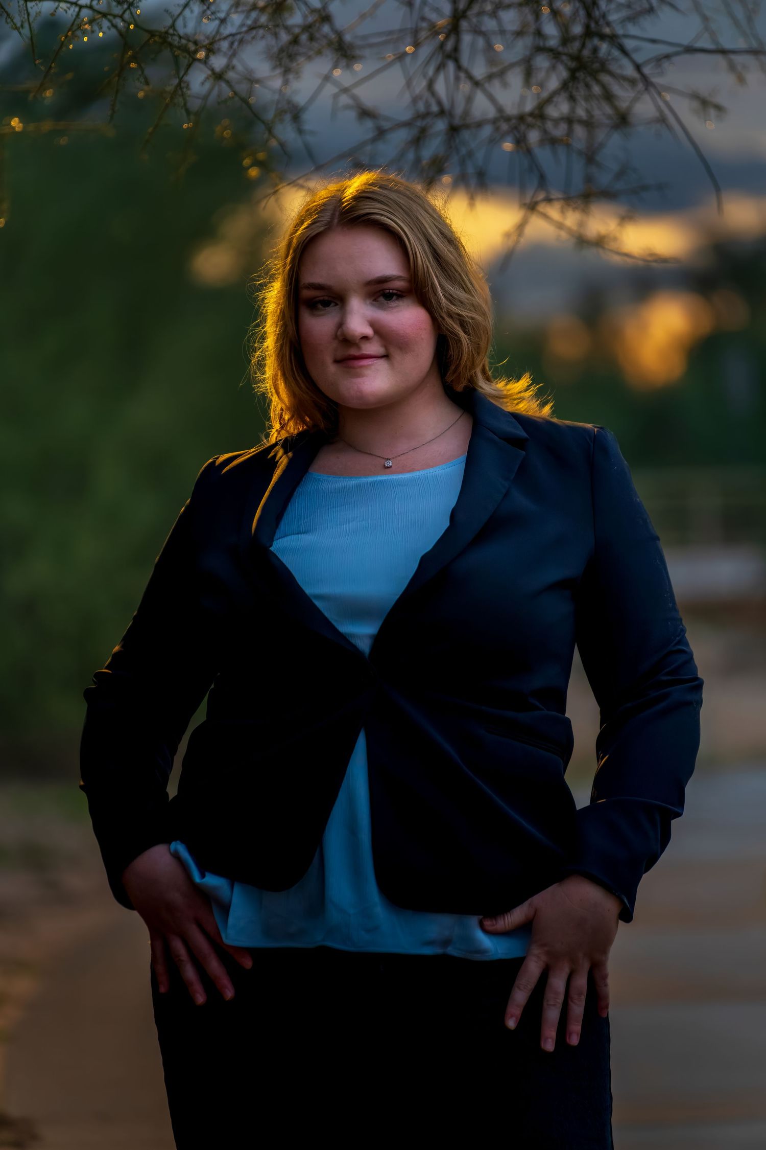 Professional outdoor portrait session captured during magical sunset lighting.