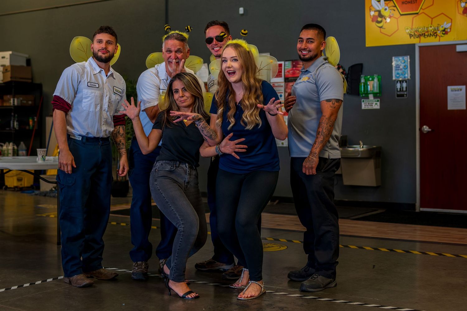 Group of employees posing together for a fun company photo.