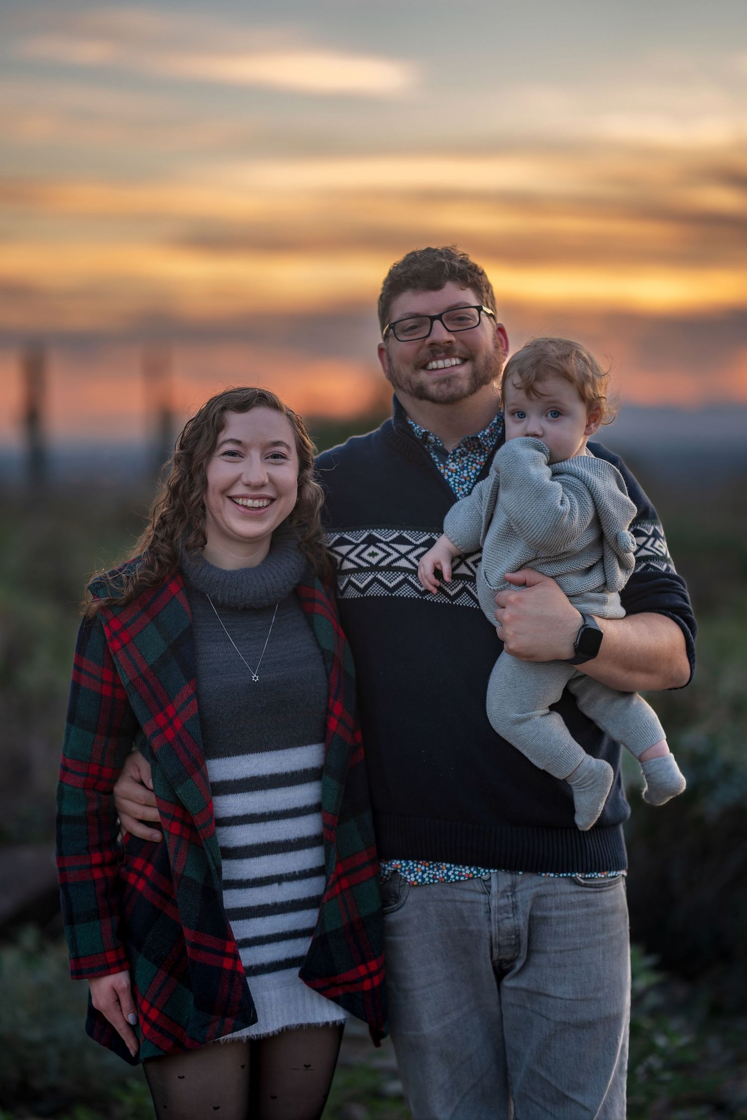 Sunset portrait series showing joyful family moments against desert landscape.