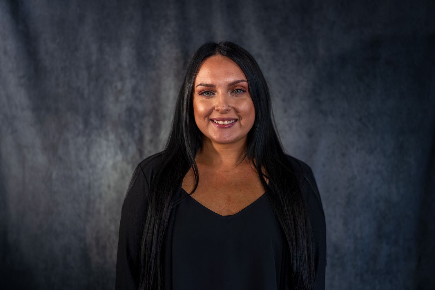 Professional headshots showing warm expressions in business attire.