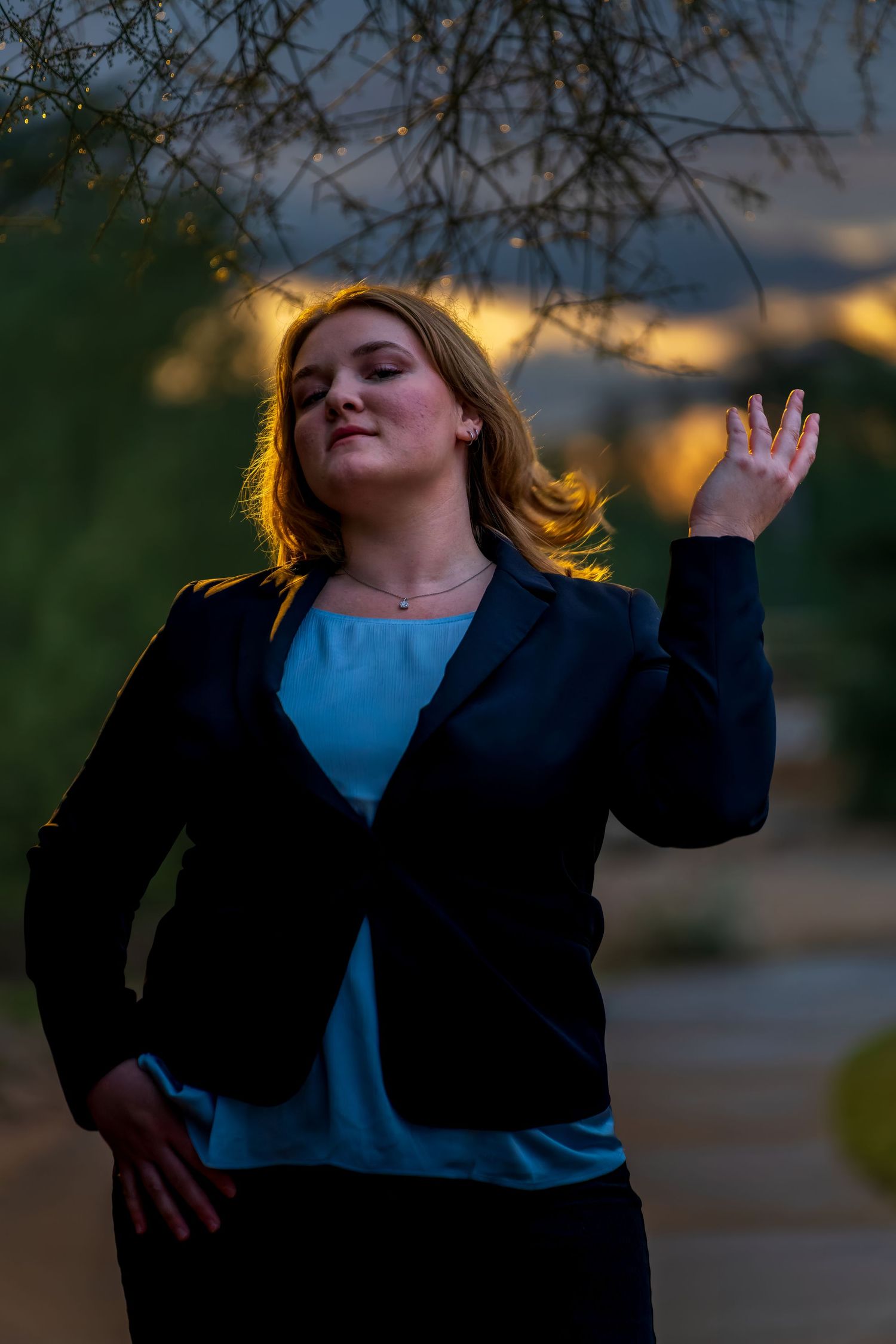 Artistic sunset portrait with dynamic movement and glowing golden light.