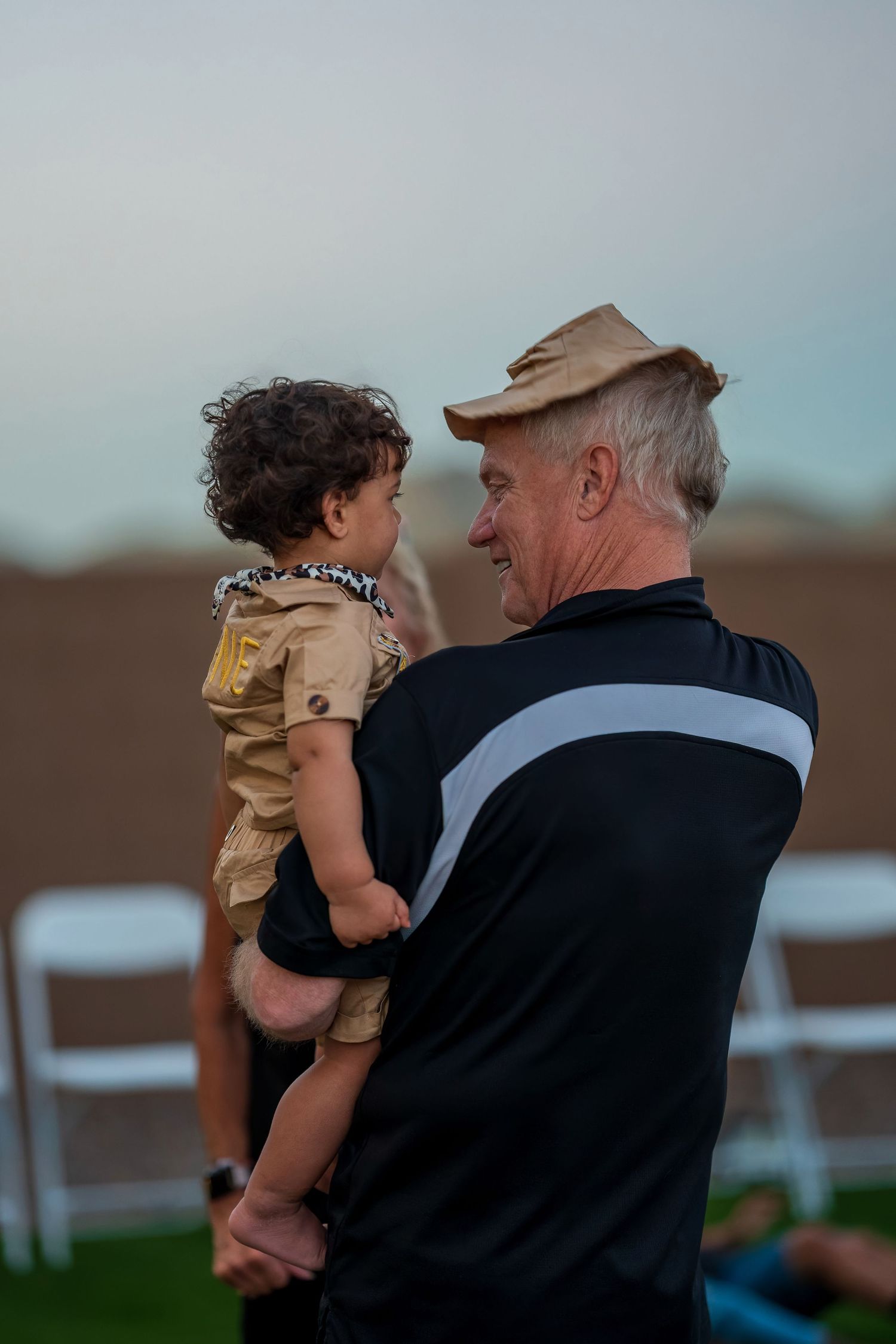 Outdoor sunset portrait at safari-themed birthday celebration.