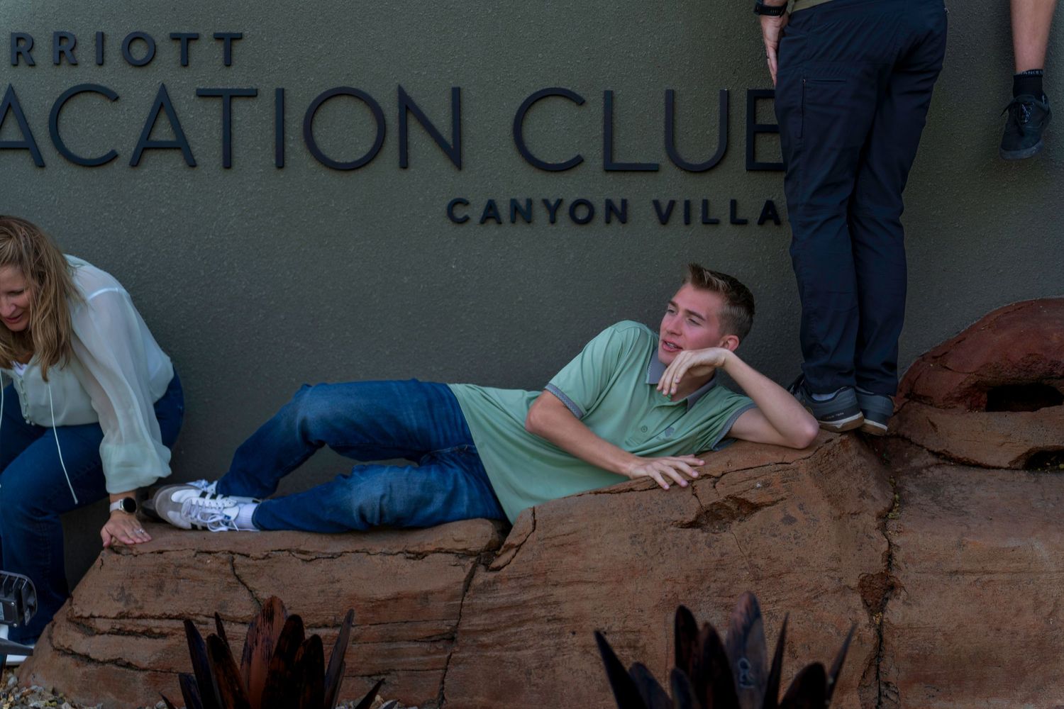 Teen relaxes on rocks at Marriott Vacation Club Canyon Villas.