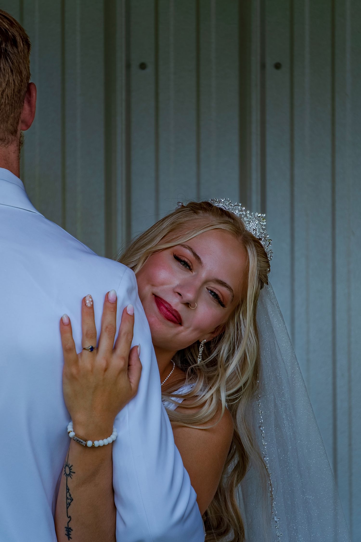 Candid wedding portraits showing emotional expressions and tender moments between newlyweds.