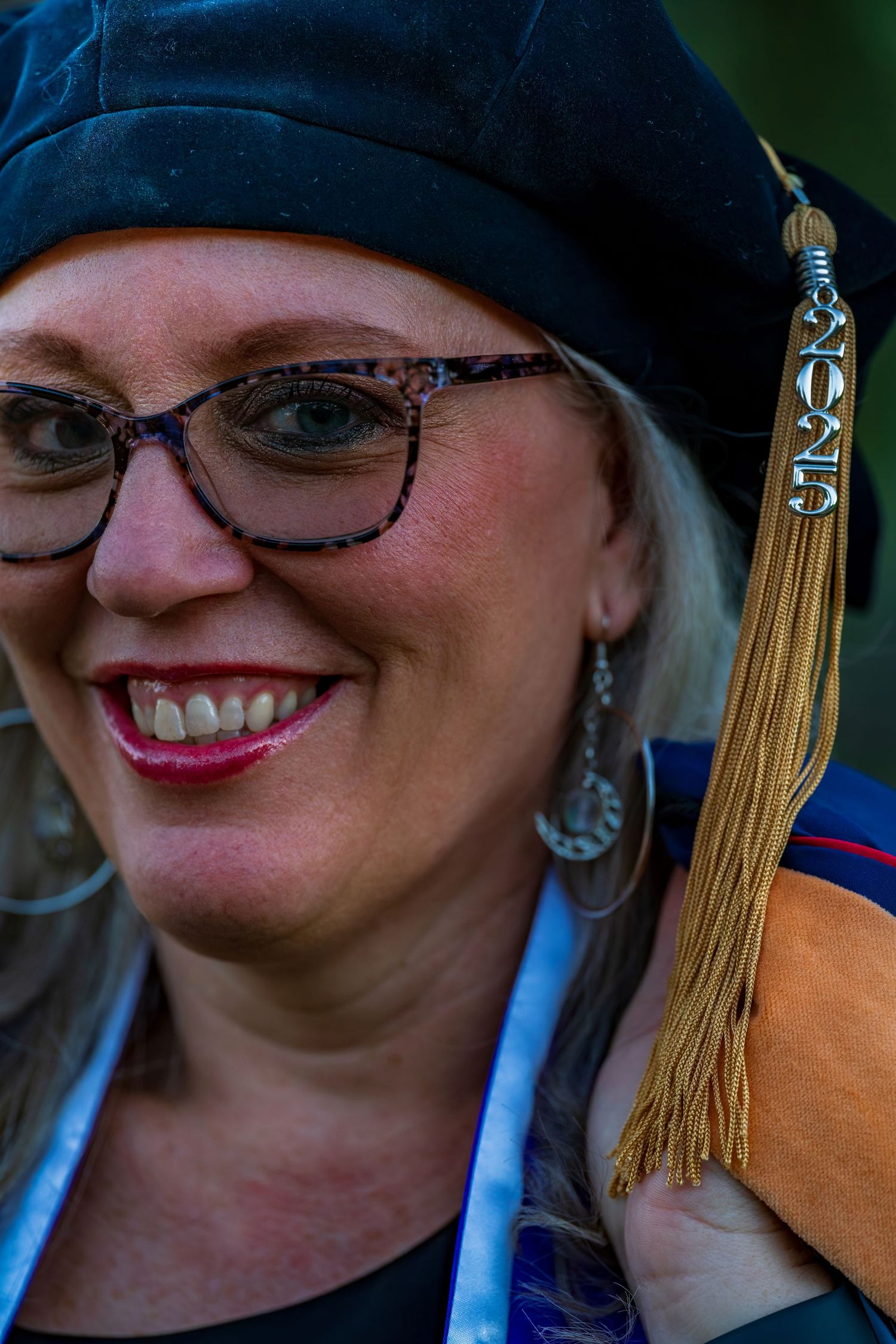 Close-up of graduation tassel and academic regalia accessories.