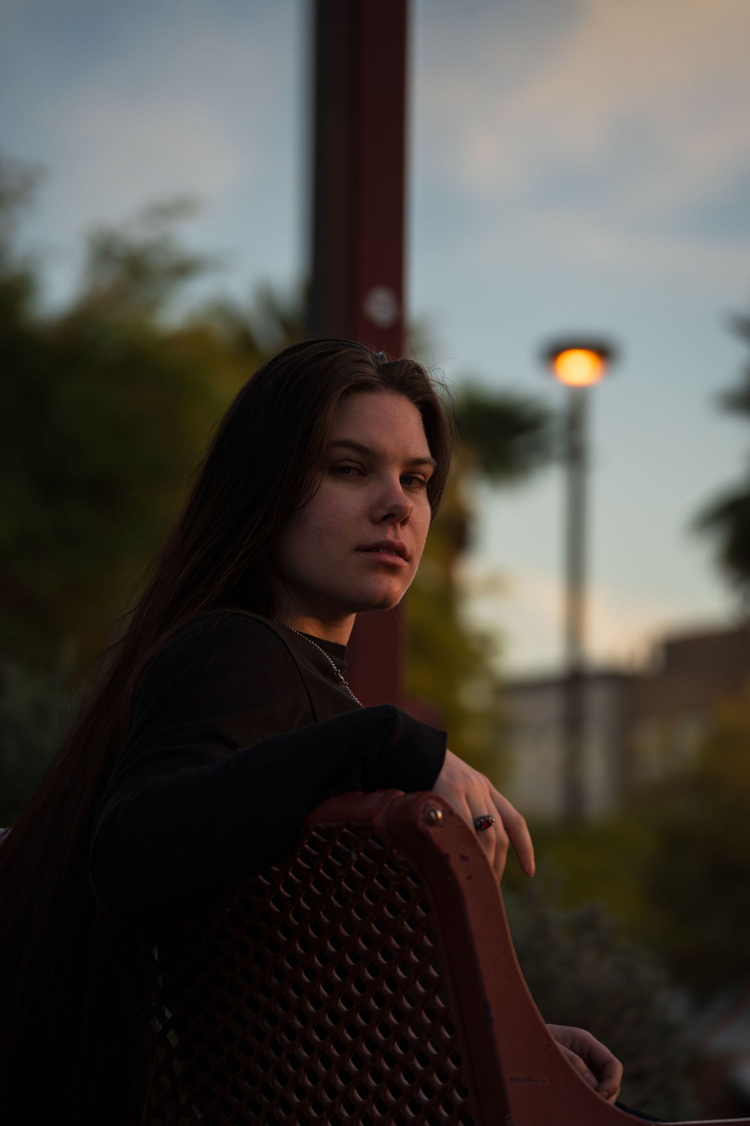 Portrait photo sequence in warm evening light showing person in brown sweater with dramatic shadows and lighting.