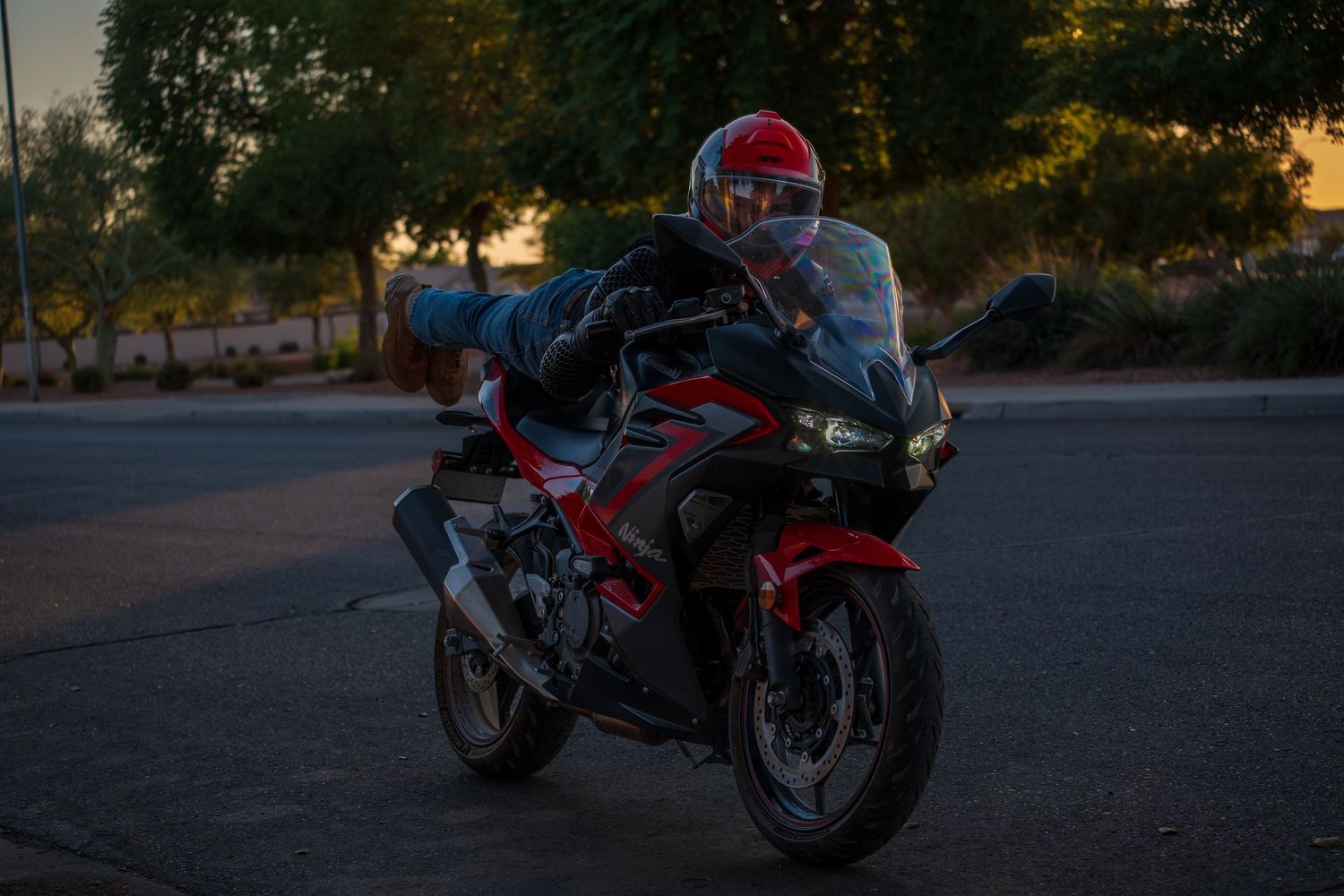 Red sport motorcycle photographed from different angles during golden hour.