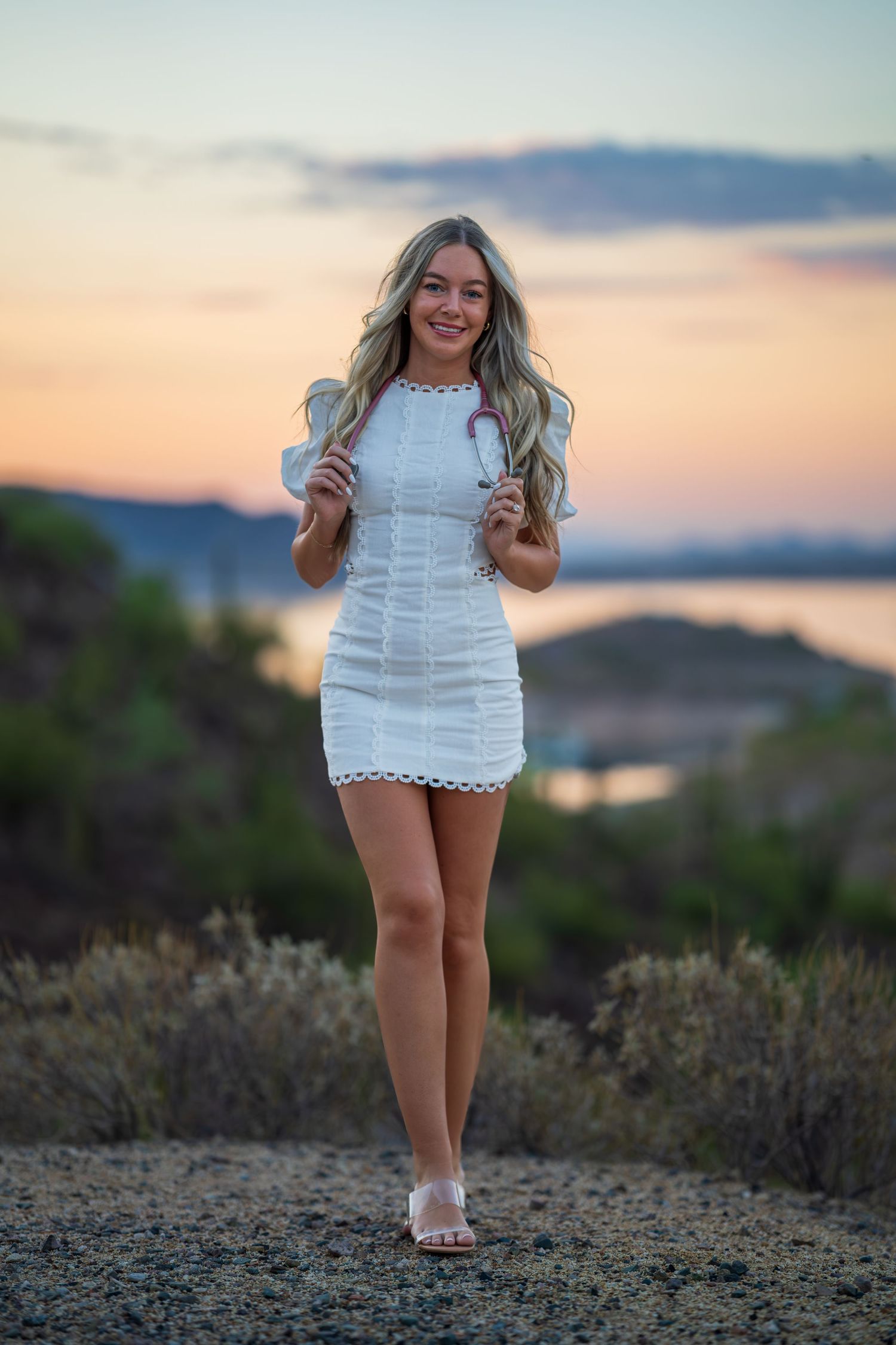Outdoor desert photography with white lace dress and natural lighting at dusk.