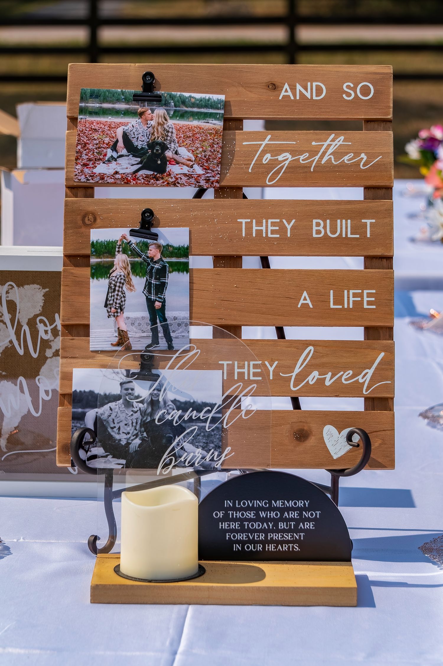 Wooden wedding memorial display with photos and text reading 'And so they built a life together'.