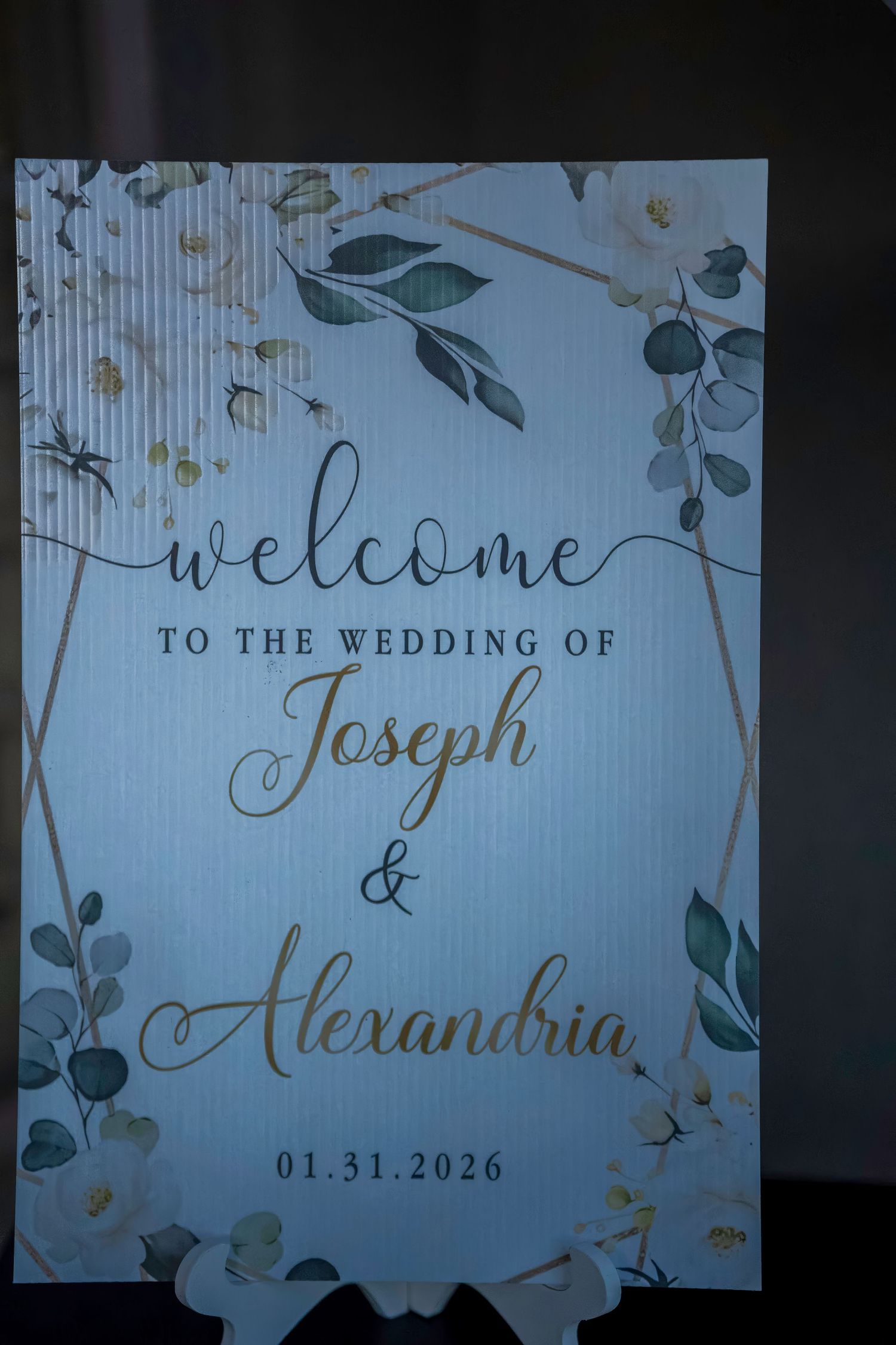 Elegant wedding welcome sign for Joseph and Alexandria with floral greenery design dated 01.31.2026.