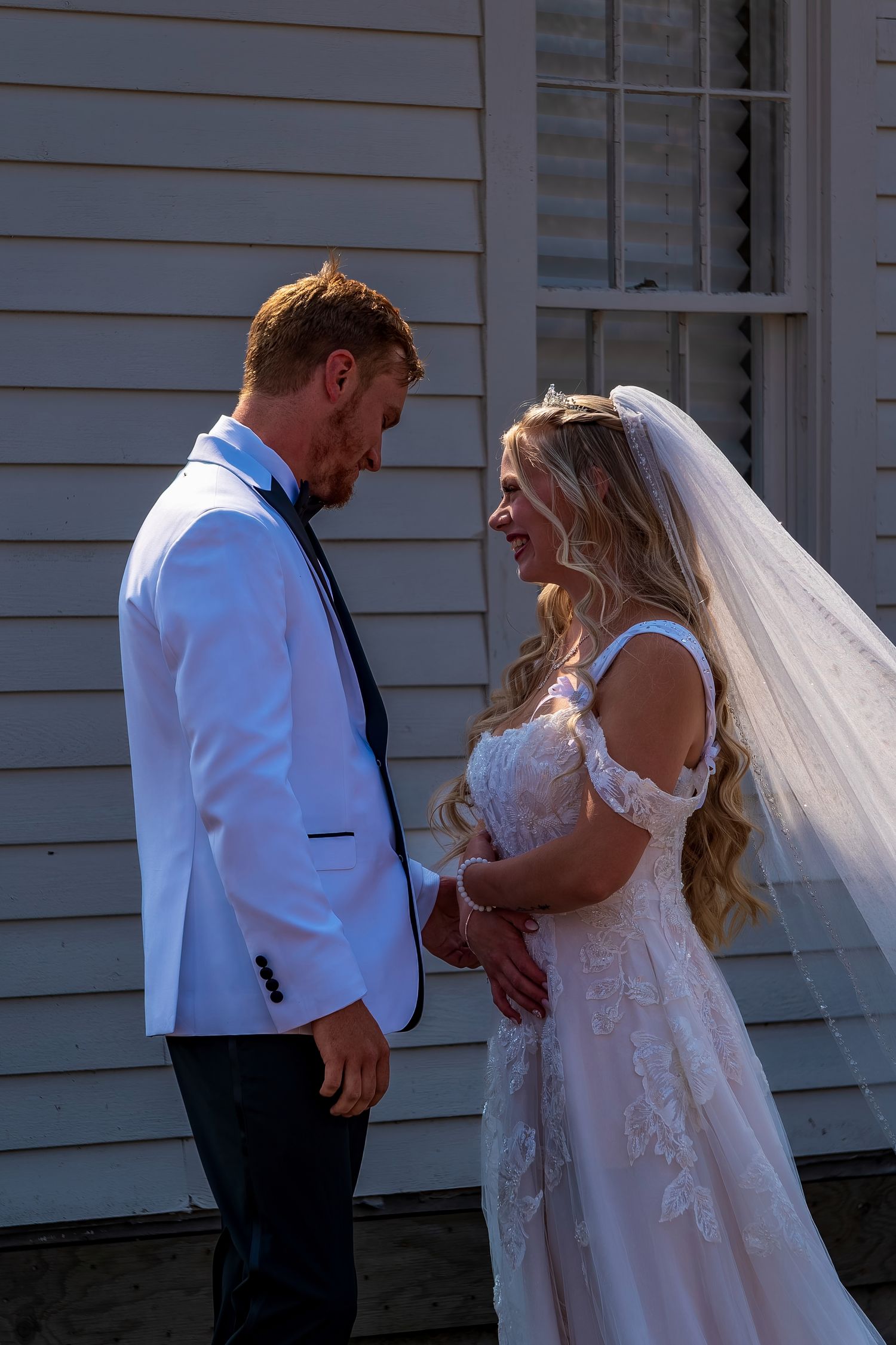Natural wedding photography showing candid interactions between couple.