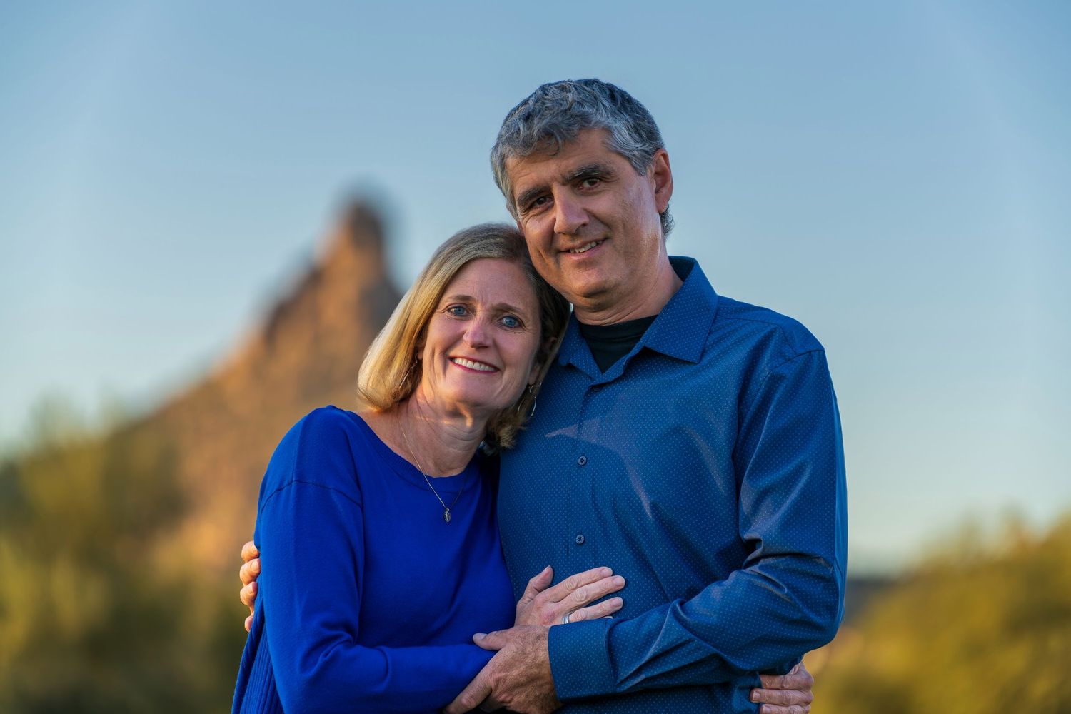 Candid family moments captured during outdoor sunset photography session.