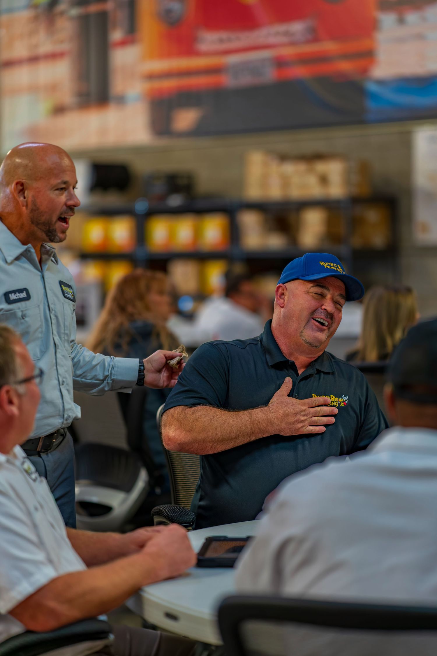 Colleagues sharing a lighthearted moment during a business meeting.