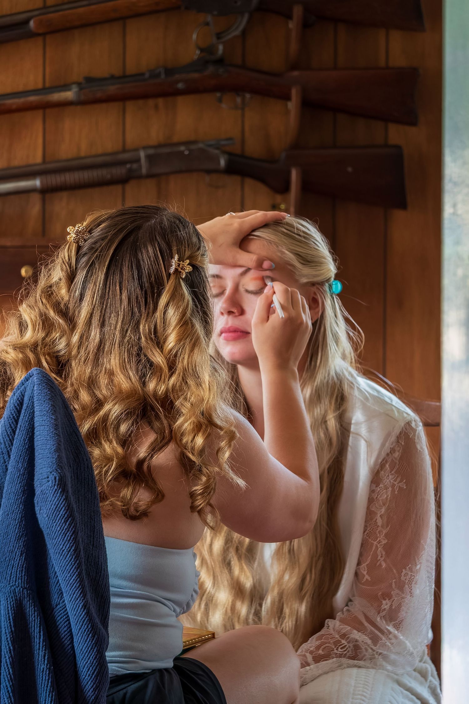 Hair styling session with curled blonde hair being prepared.