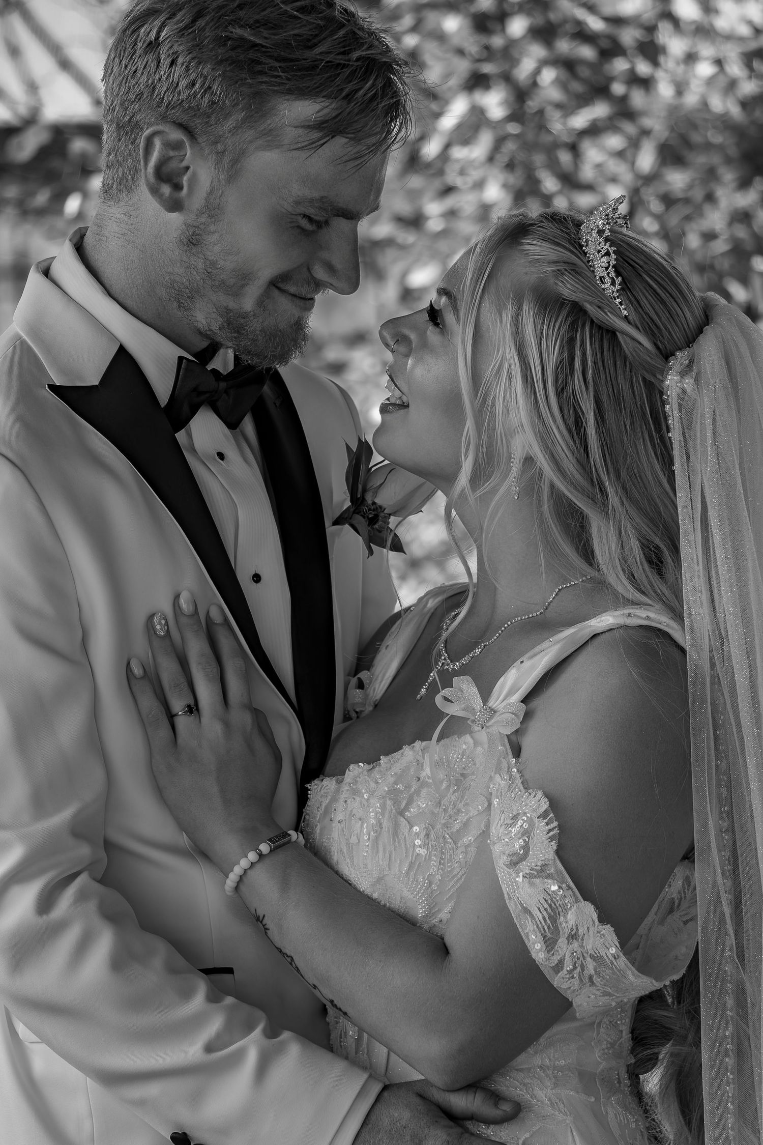 Intimate black and white wedding photography sequence showing tender moments.