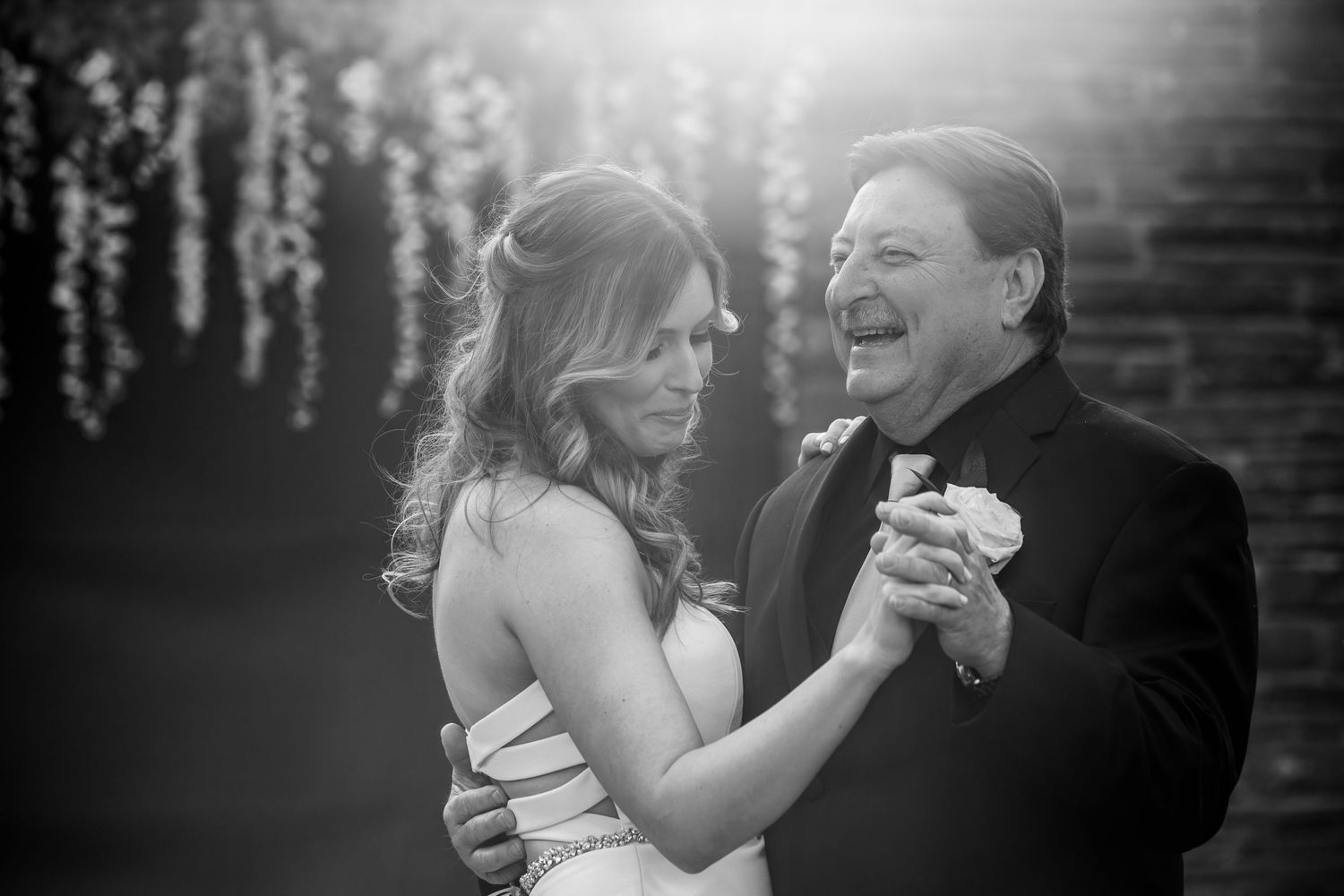 Black-and-white photo of bride and her father sharing an emotional father-daughter dance, Xenia Helix Photography, Boston, MA