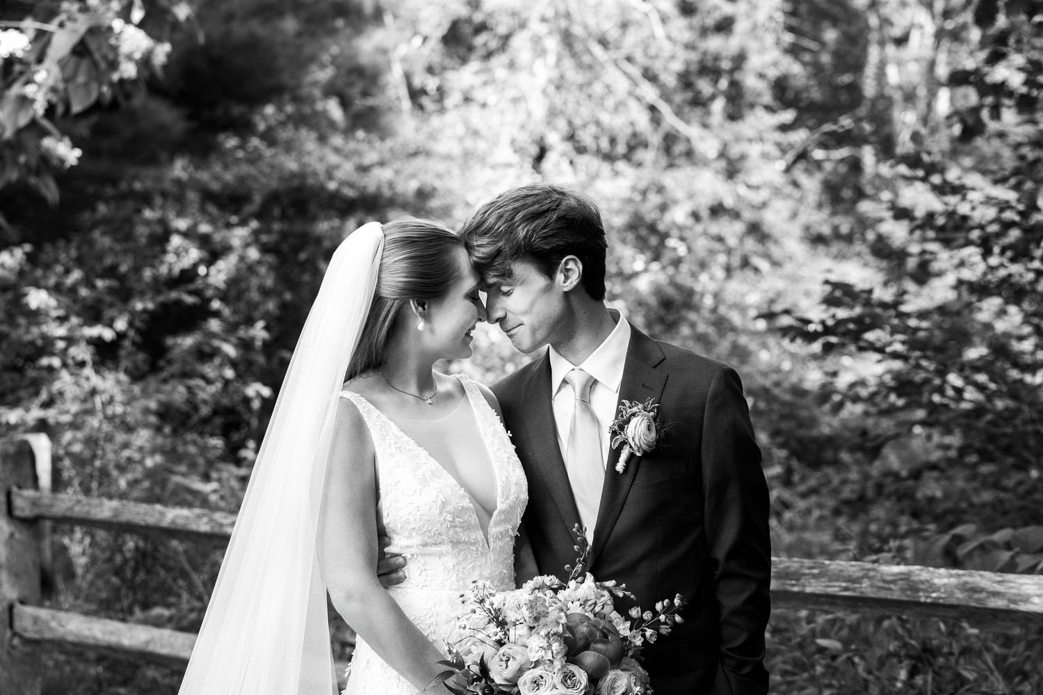 Bride and groom sharing a romantic moment outdoors on a wedding day, black-and-white photo, Grove at Briar Barn Inn, Rowley, MA