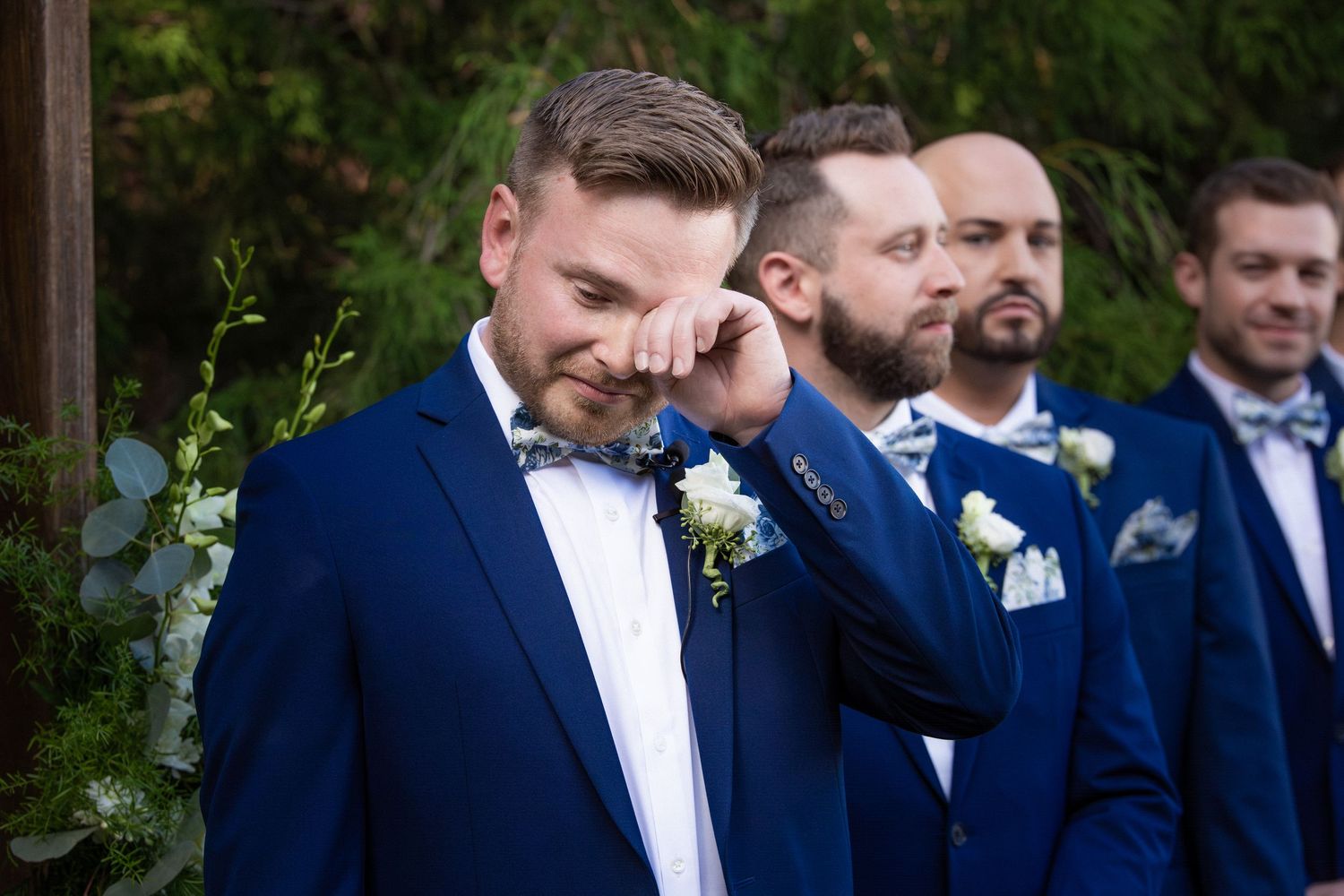 Groom wipes tears while standing with groomsmen at wedding ceremony, Stevens Estate at Osgood  Hill, North Andover, MA