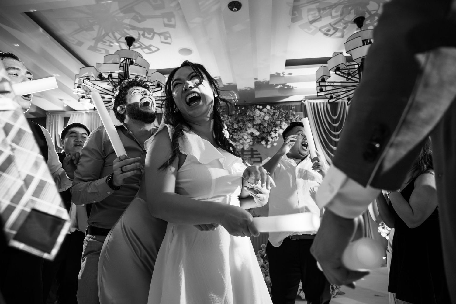 Joyful bride laughing during lively wedding reception dance in black and white photo, Xenia Helix Photography, Boston, MA