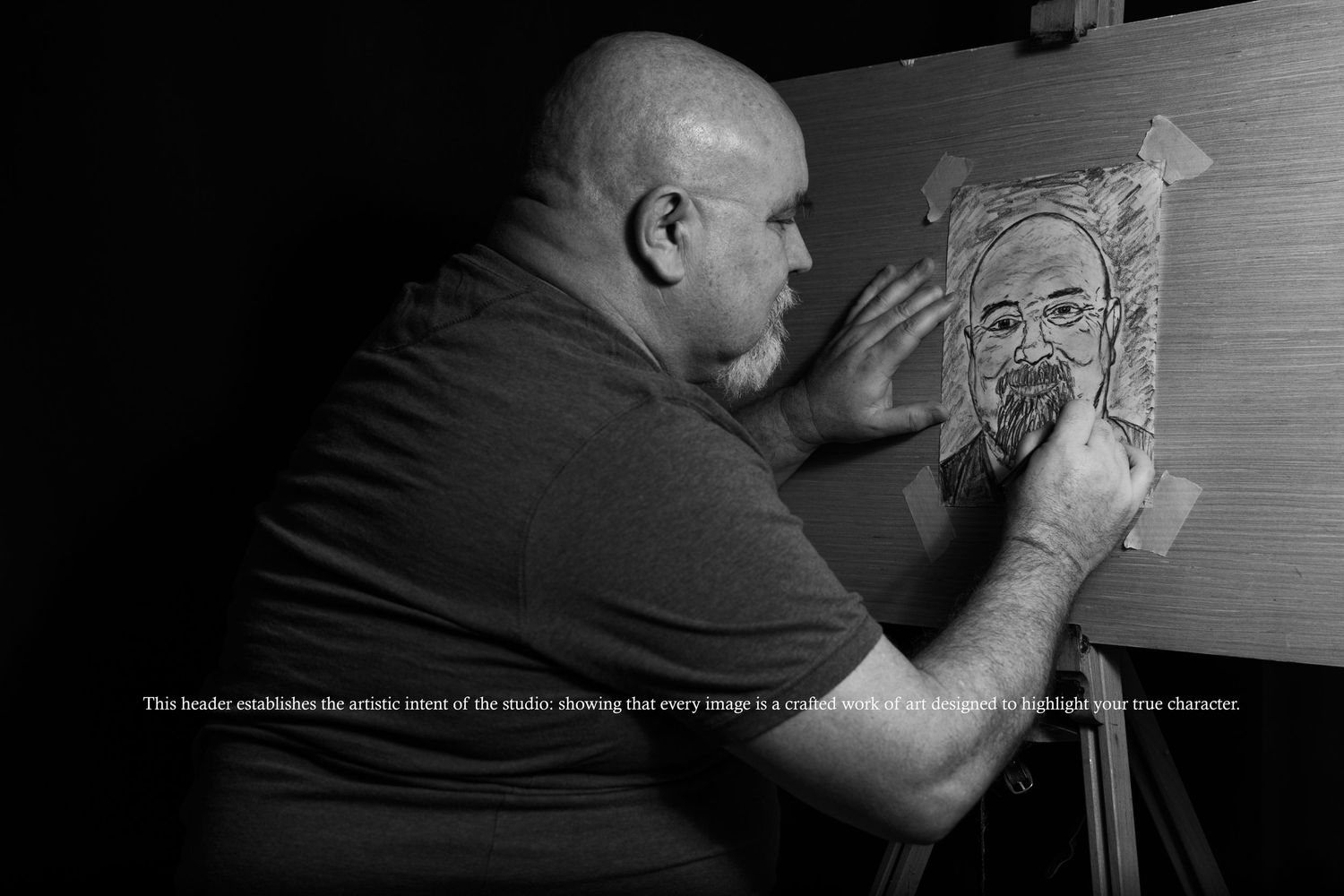 B&W self-portrait of Rab Carrigan sketching at an easel; showcasing the artistic process behind every cinematic portrait.