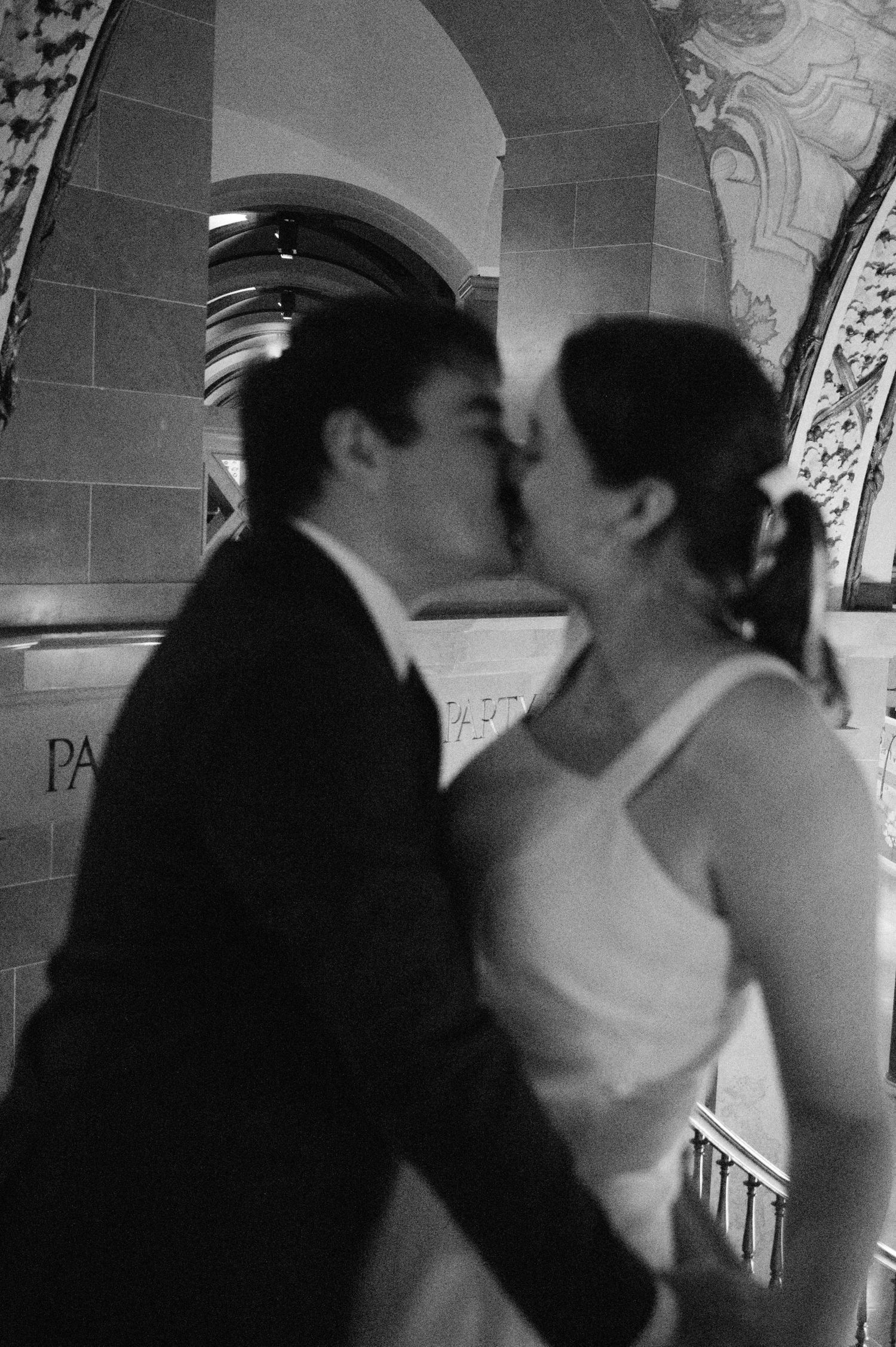 Black and white sequence showing a couple in formal attire.