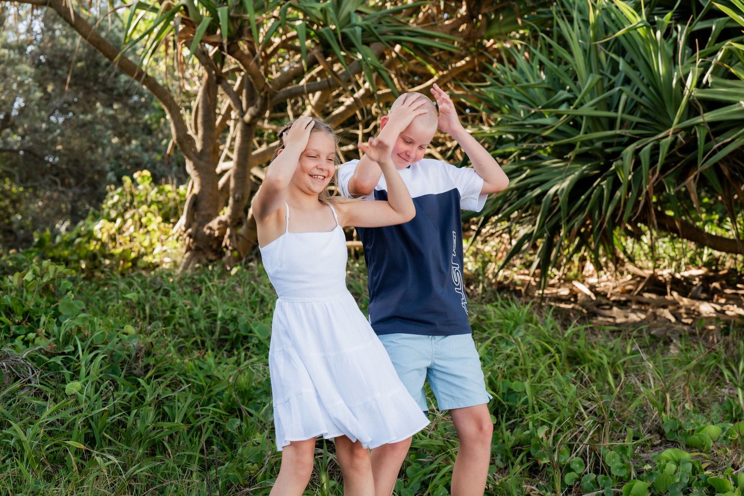 Candid photo of an energetic child during a family photography session on the Tweed Coast.