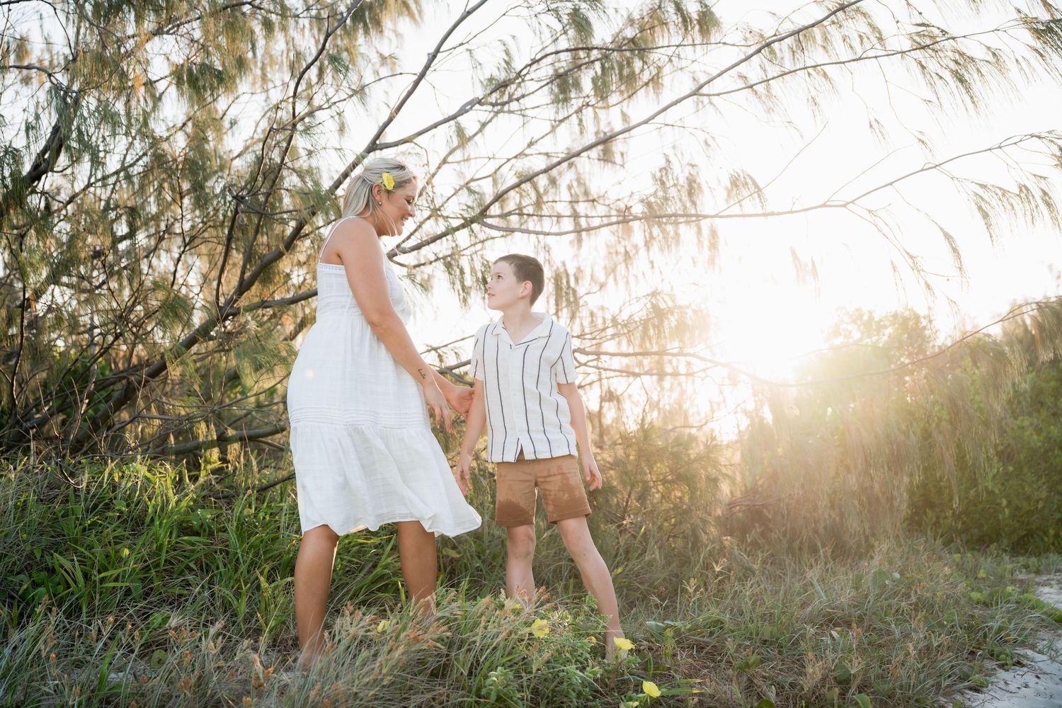 Mum and son laughing together at a Tweed Coast beach session with WOnderland Photography