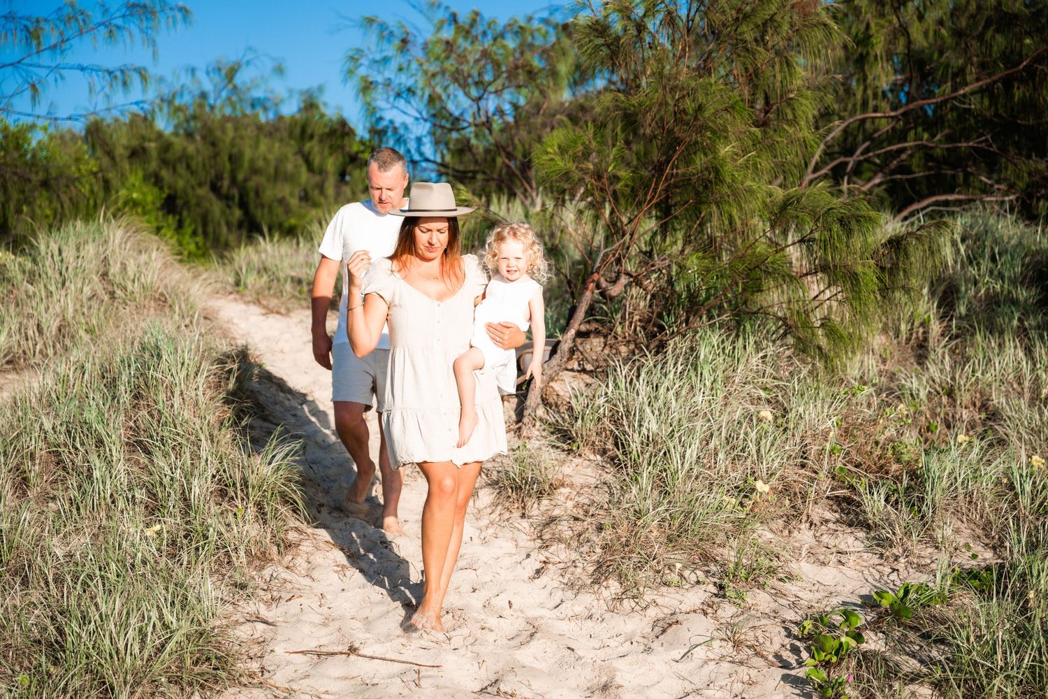 Family exploring Kingscliff beach at sunrise session with WOnderland Photography