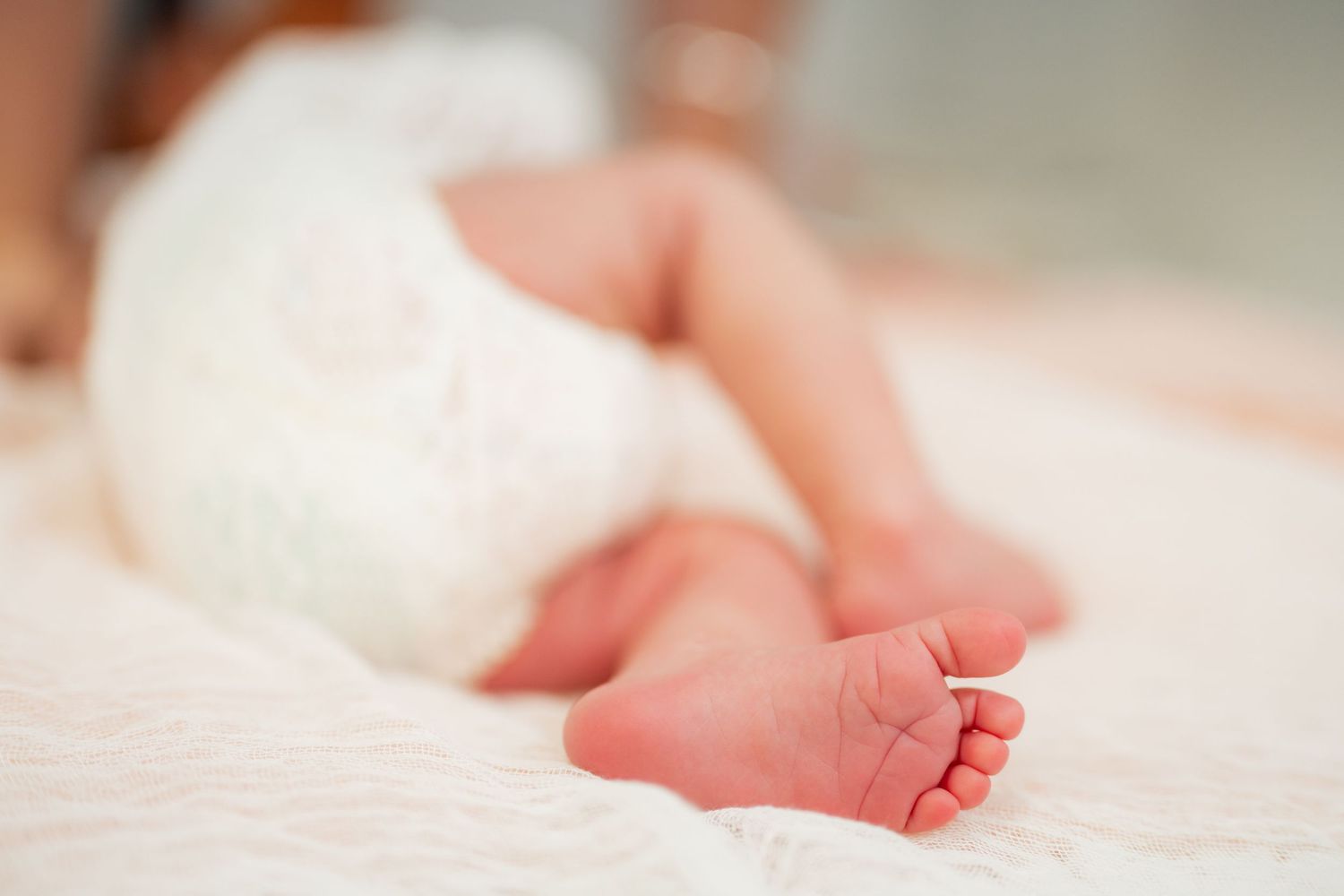 Newborn baby feet in studio photography session.