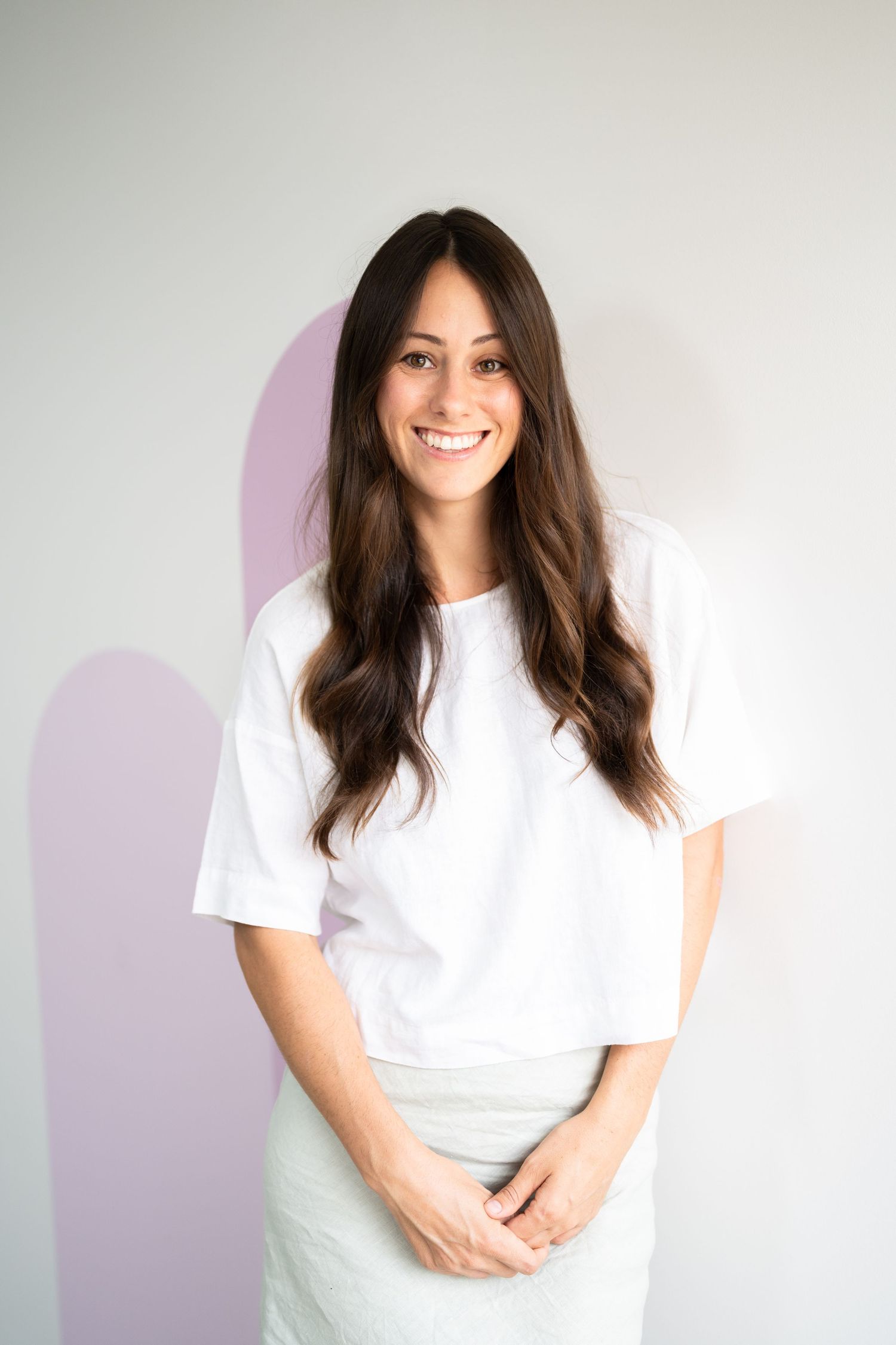 Person wearing white t-shirt poses against light background in progression of casual portrait shots.