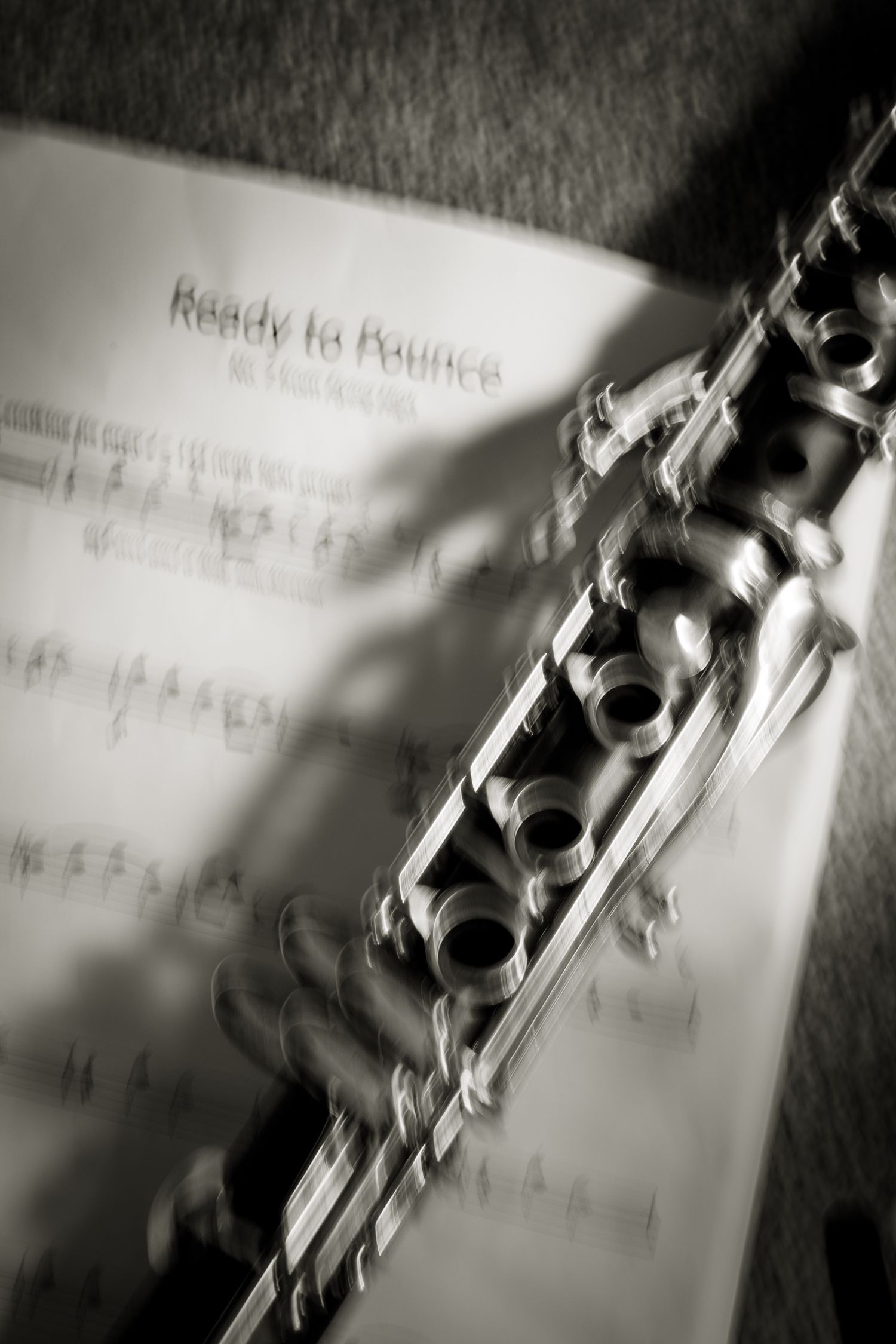International camera movement depicting a clarinet and music behind.
