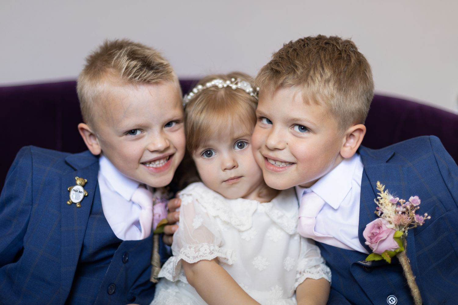 Close up of 2 page boys and flower girl in Chelsea o|d town hall, London borough of Kensington and Chelsea.