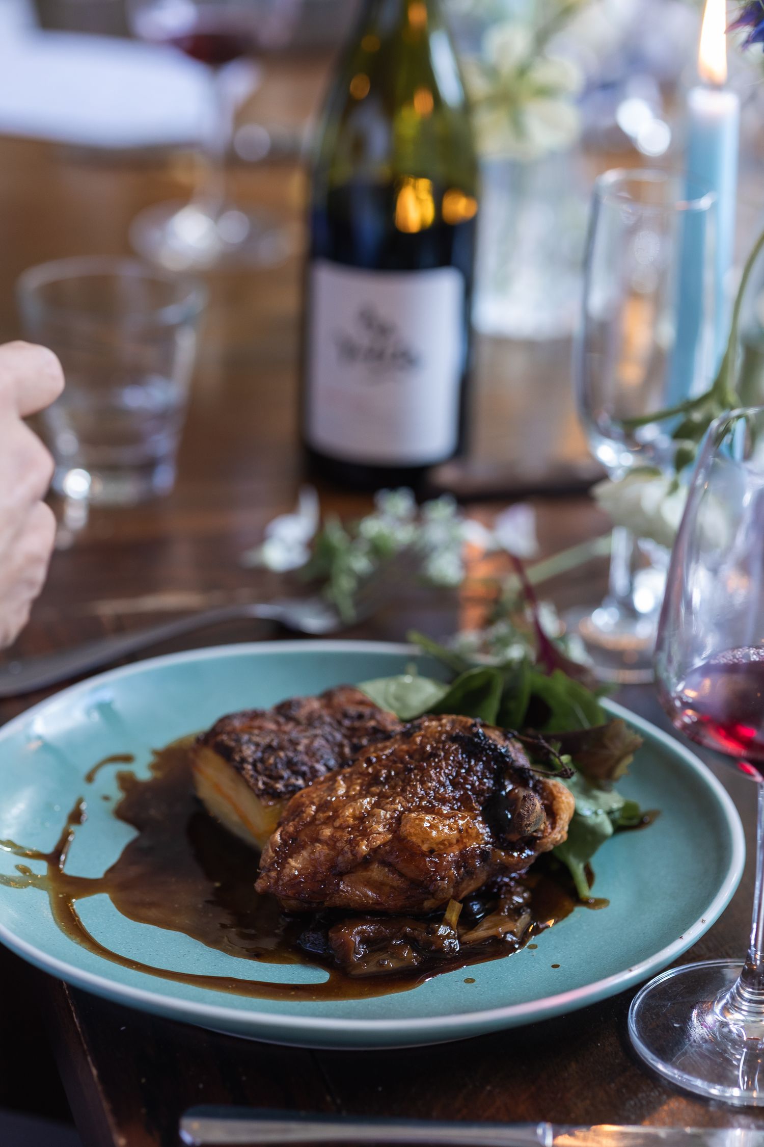 Guests enjoying food and wine at The Lady Ottoline in London