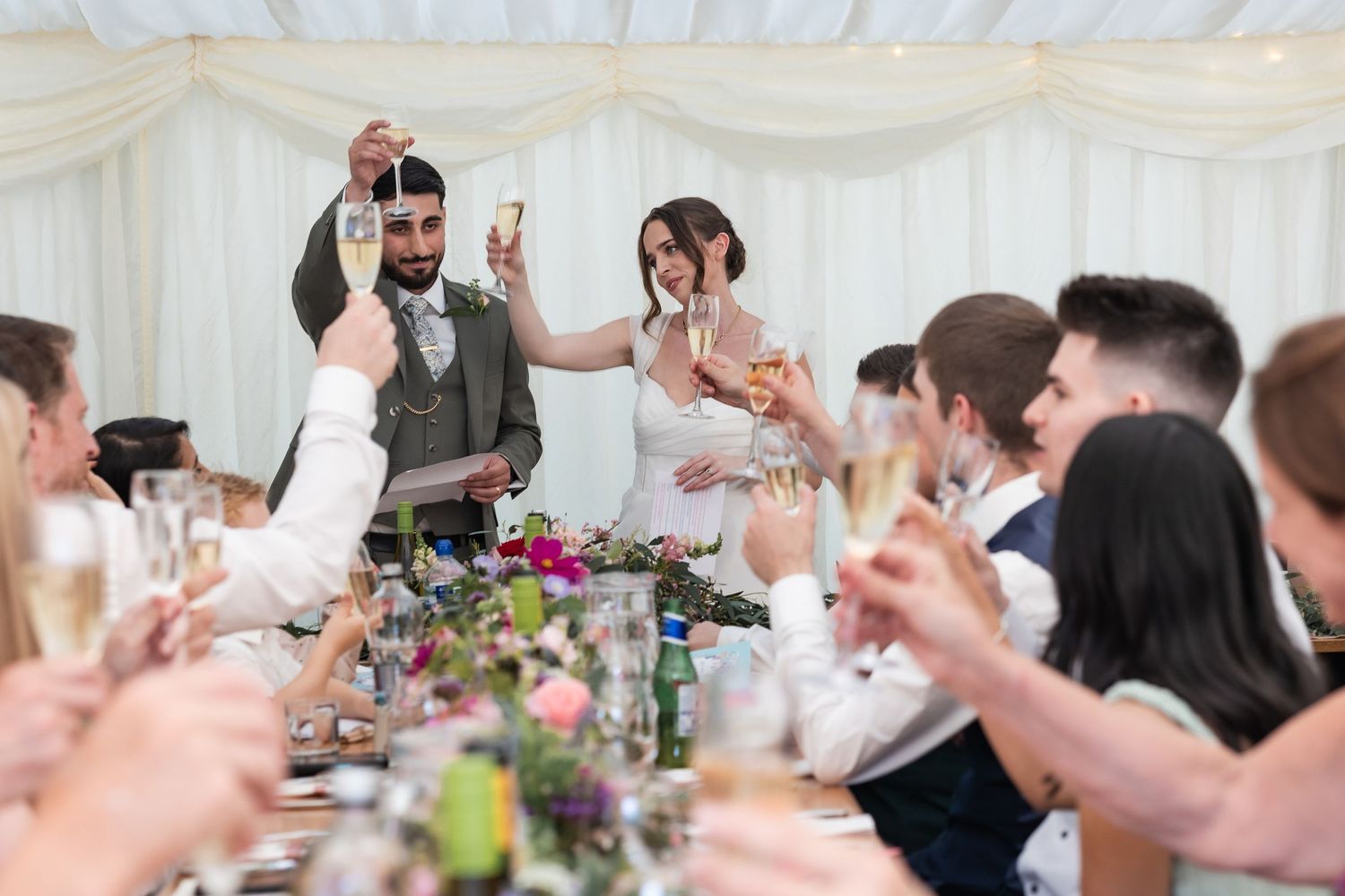 Toasts shared during an intimate wedding celebration in Ware, Hertfordshire.