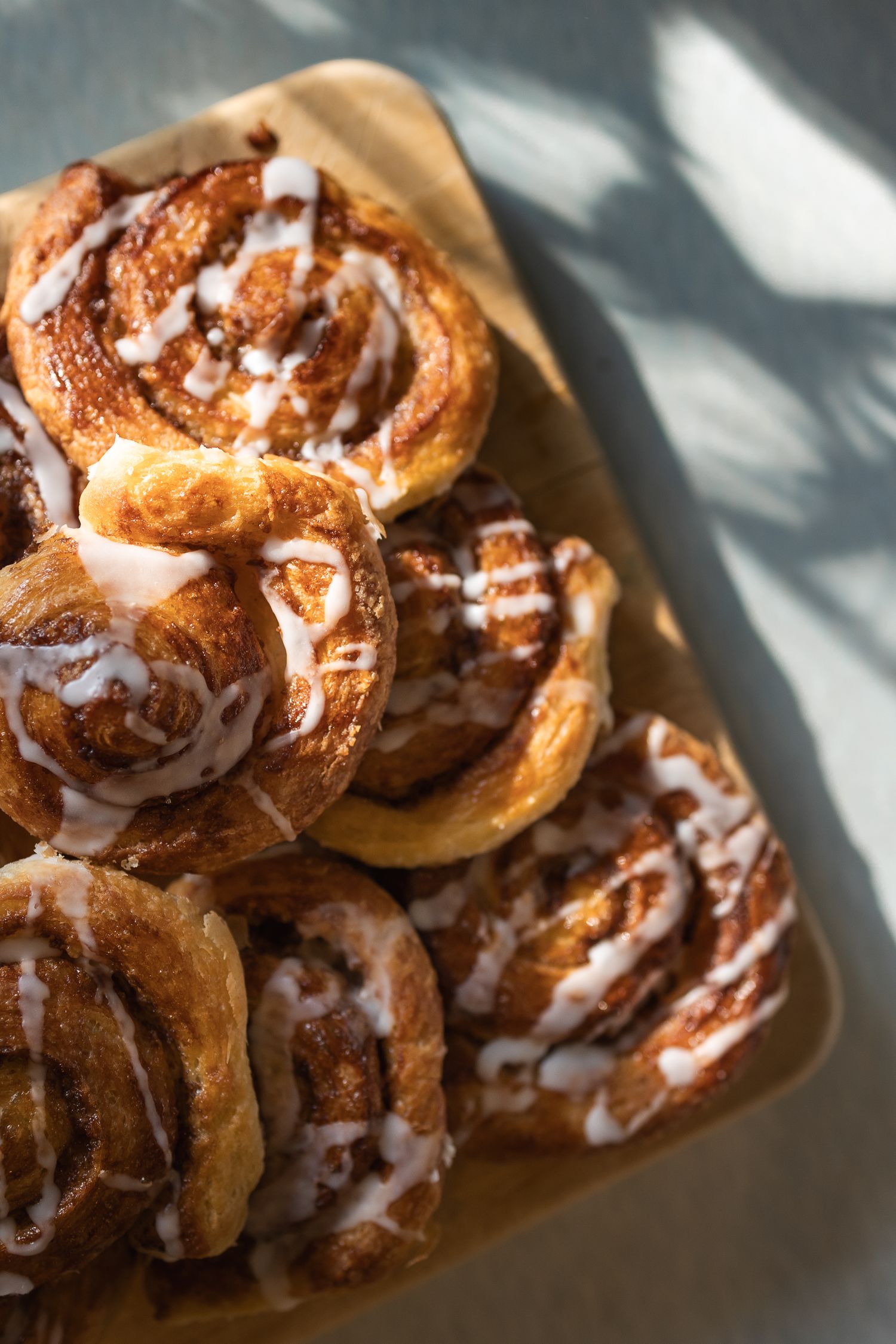 Subtle shadows cast over homemade cinnamon swirls.