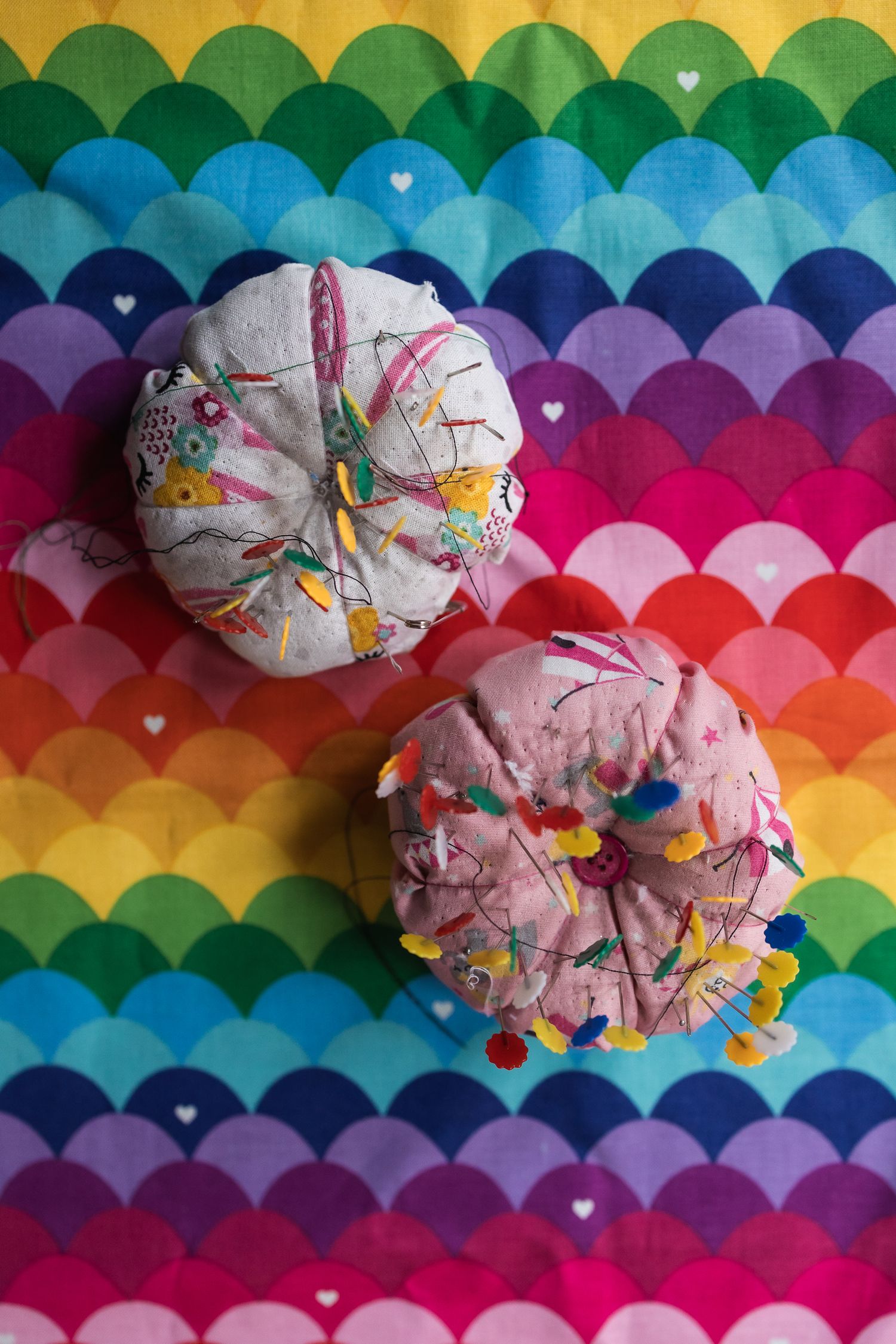 Flatlay photo of pin cushions for local barnet sewing small business.